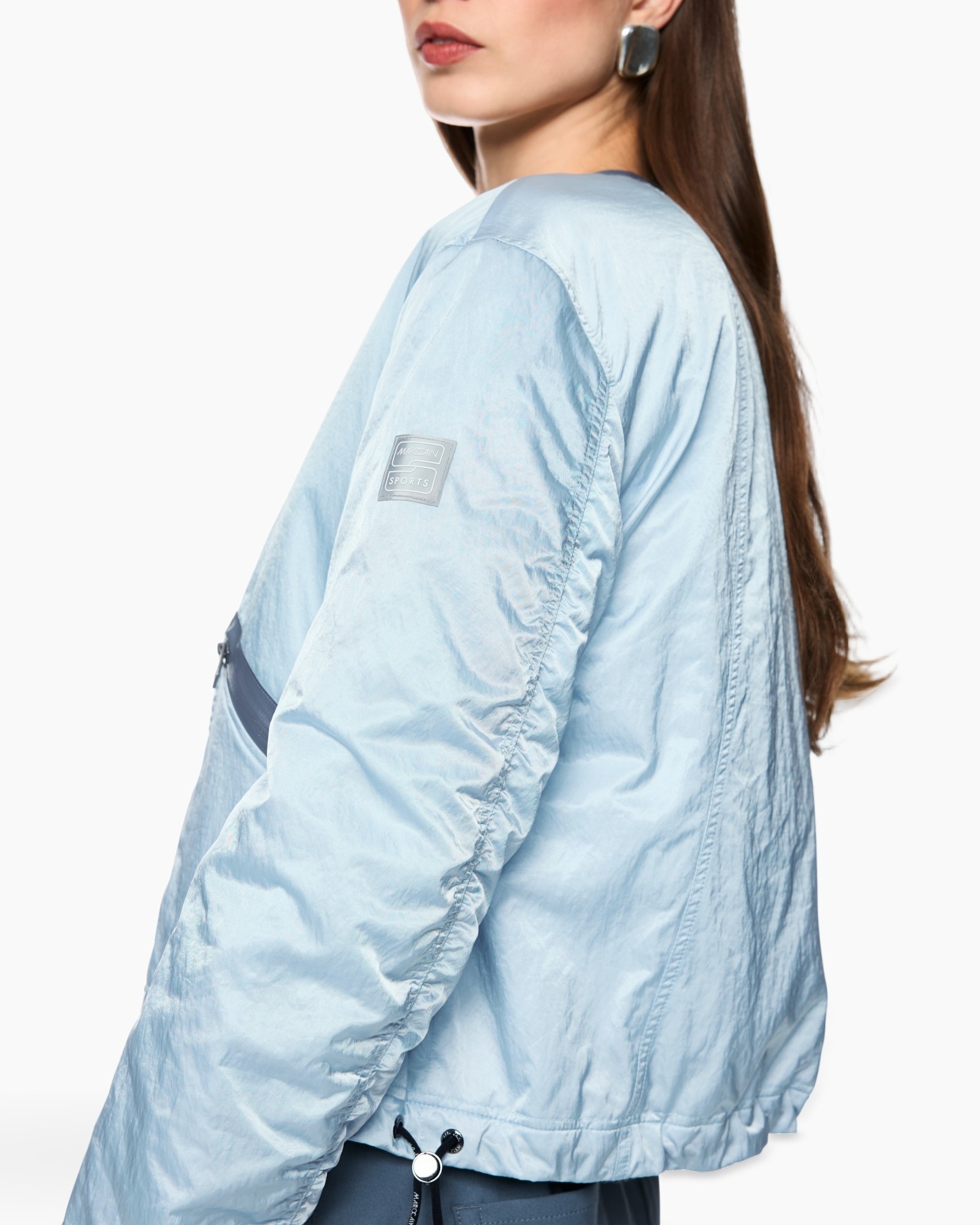 light-blue jacket, windbreaker, padded jacket, long sleeve, metallic patch