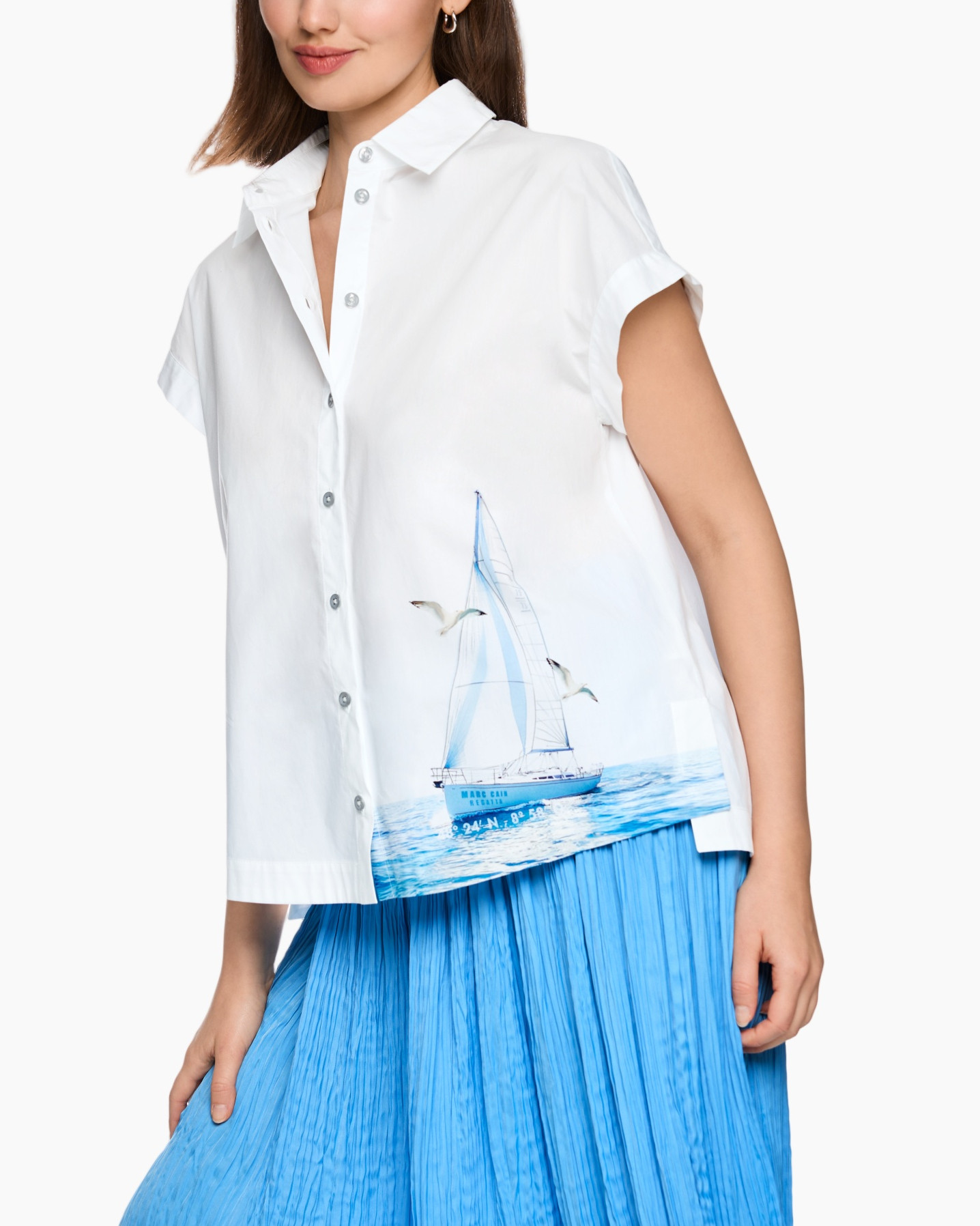 white shirt, short sleeves, sailboat print, blue skirt, button front