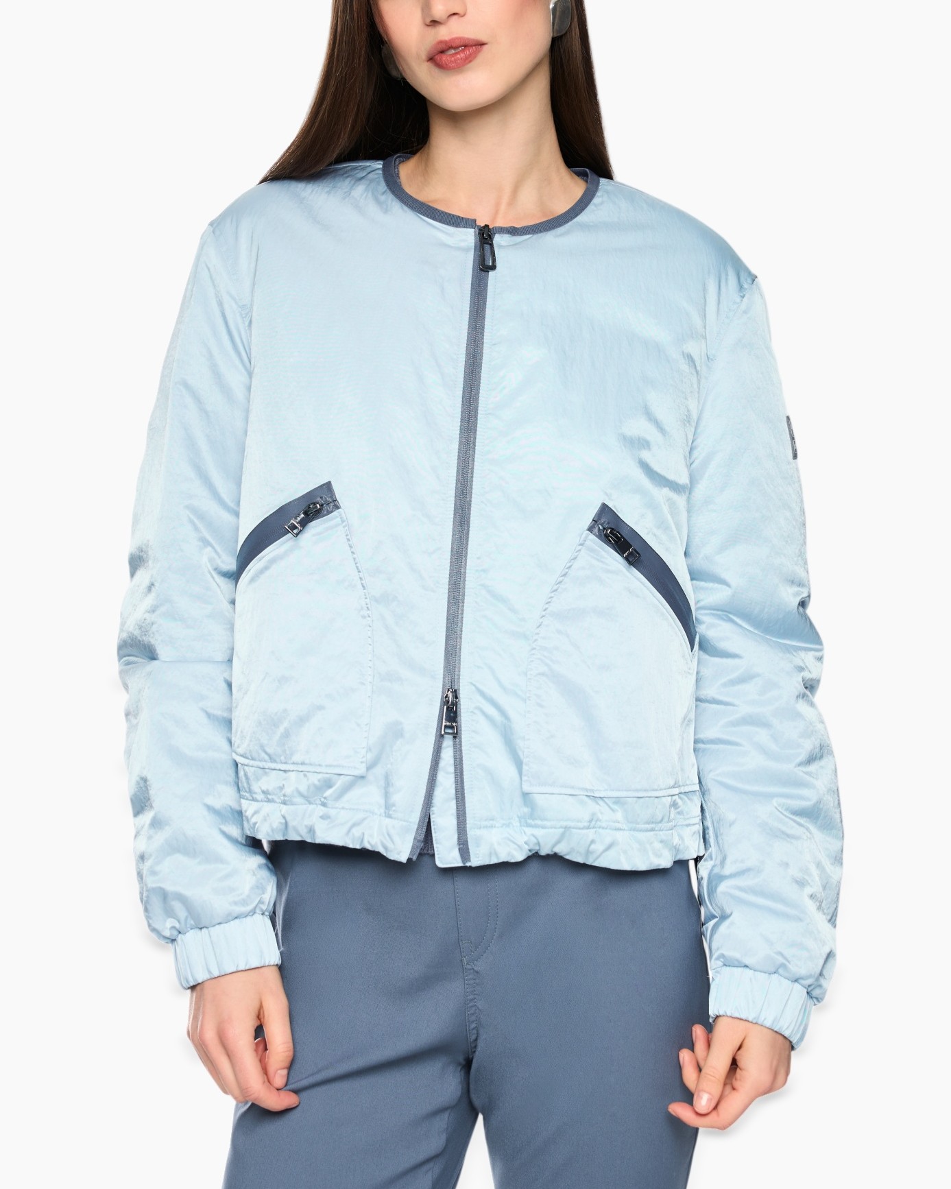 light blue jacket, bomber jacket, zipper, pockets, elastic hem