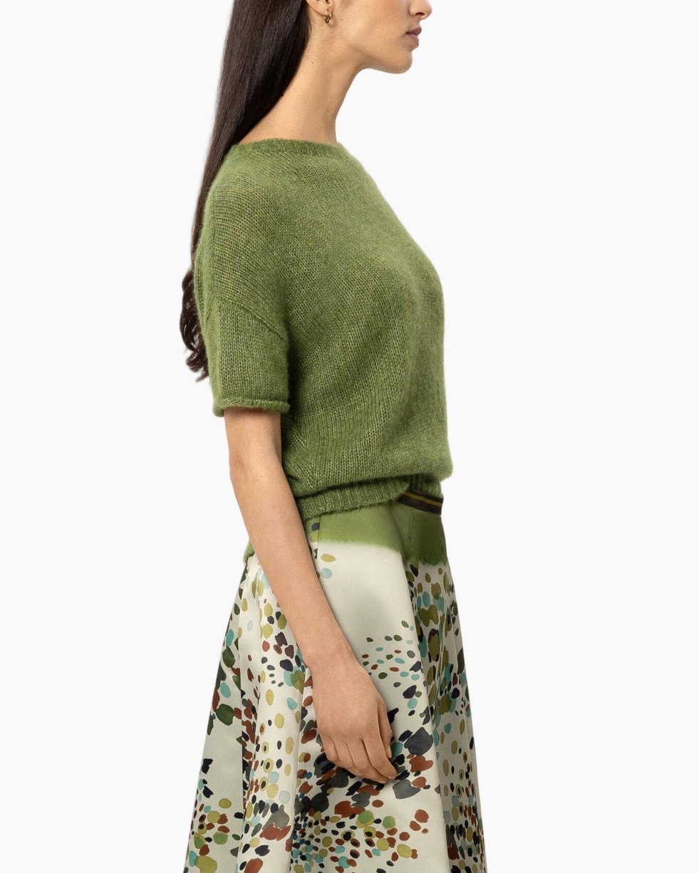 green knit sweater, short sleeve knit, crew neck, skirt with pattern, visually green hue