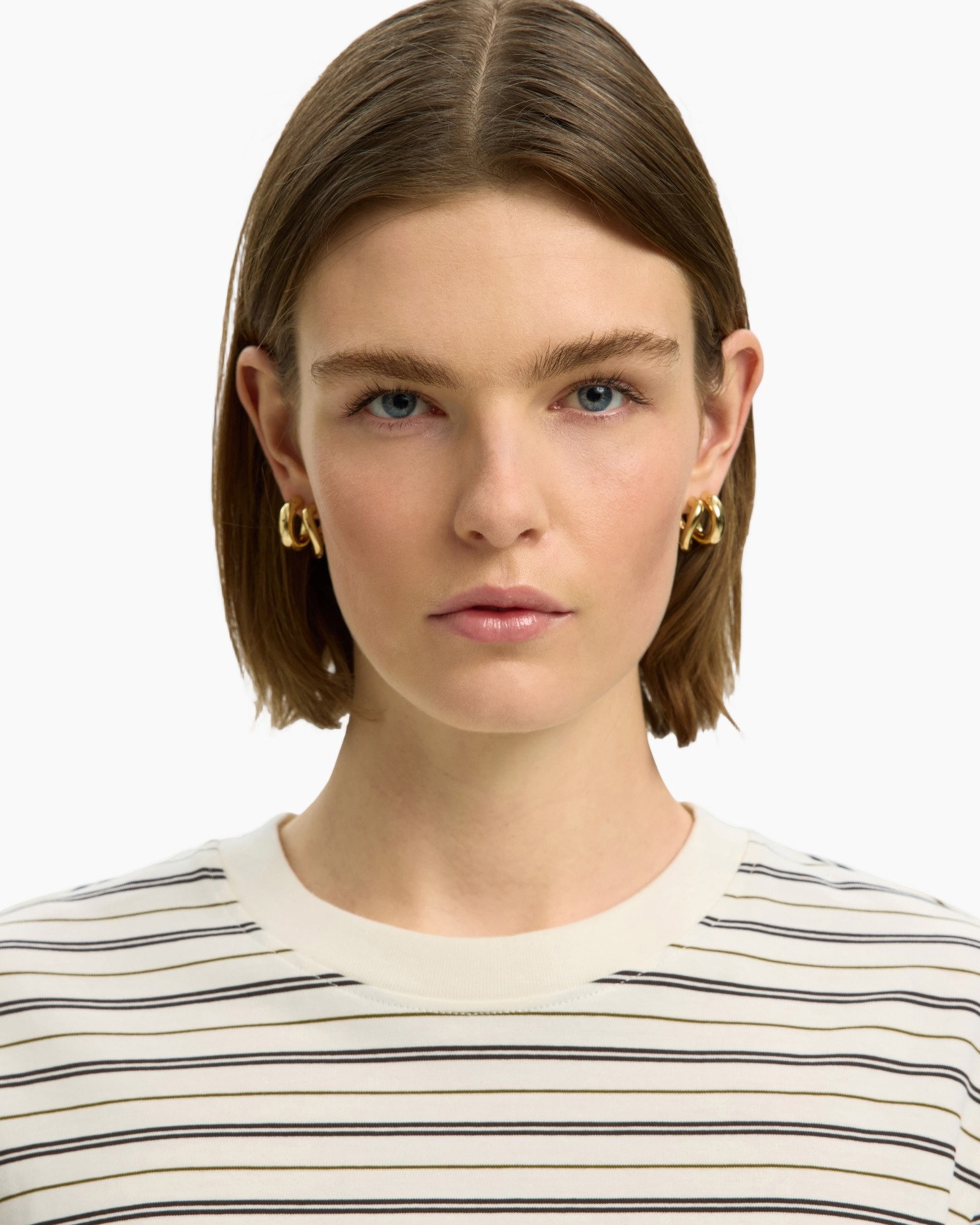 striped shirt, crew neck, horizontal stripes, gold earrings, short hair