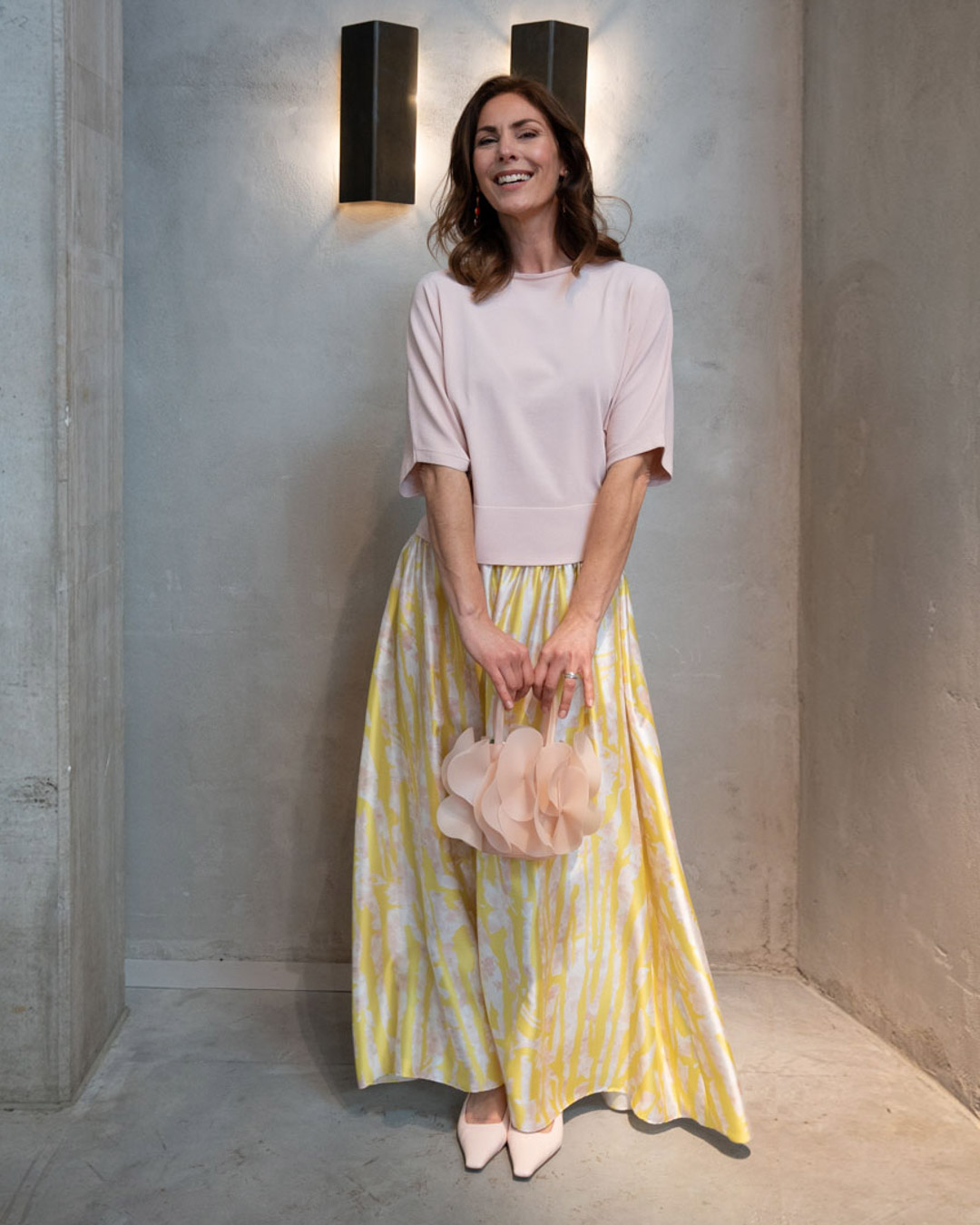 dress, skirt, soft-pink top, pale yellow pattern, handbag
