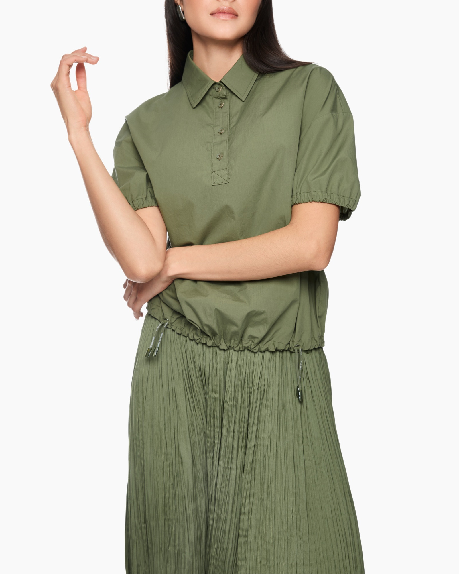 short-sleeve polo, green top, drawstring waist, pleated skirt, button placket
