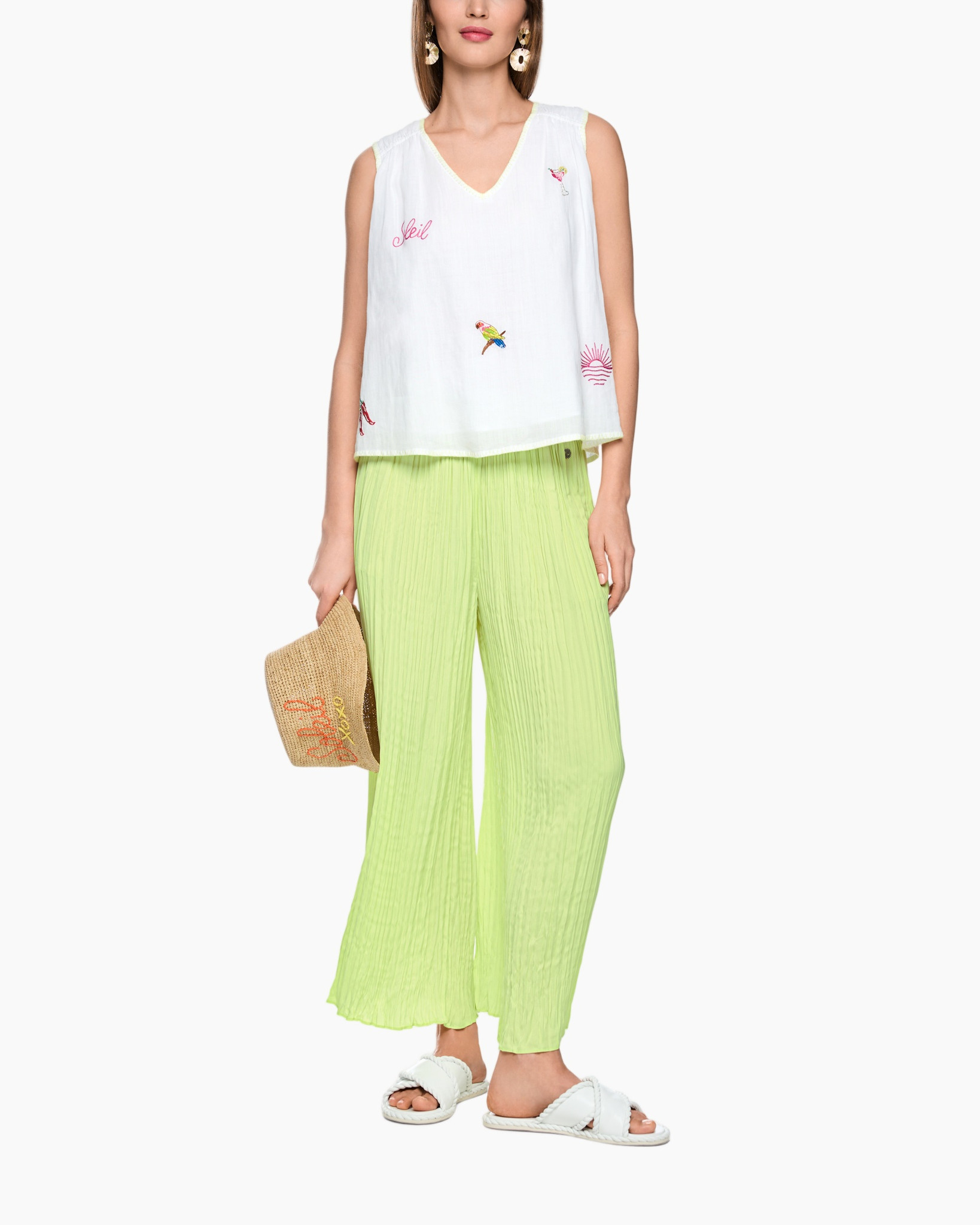 white sleeveless top, embroidery, lime green pants, pleated, flat sandals