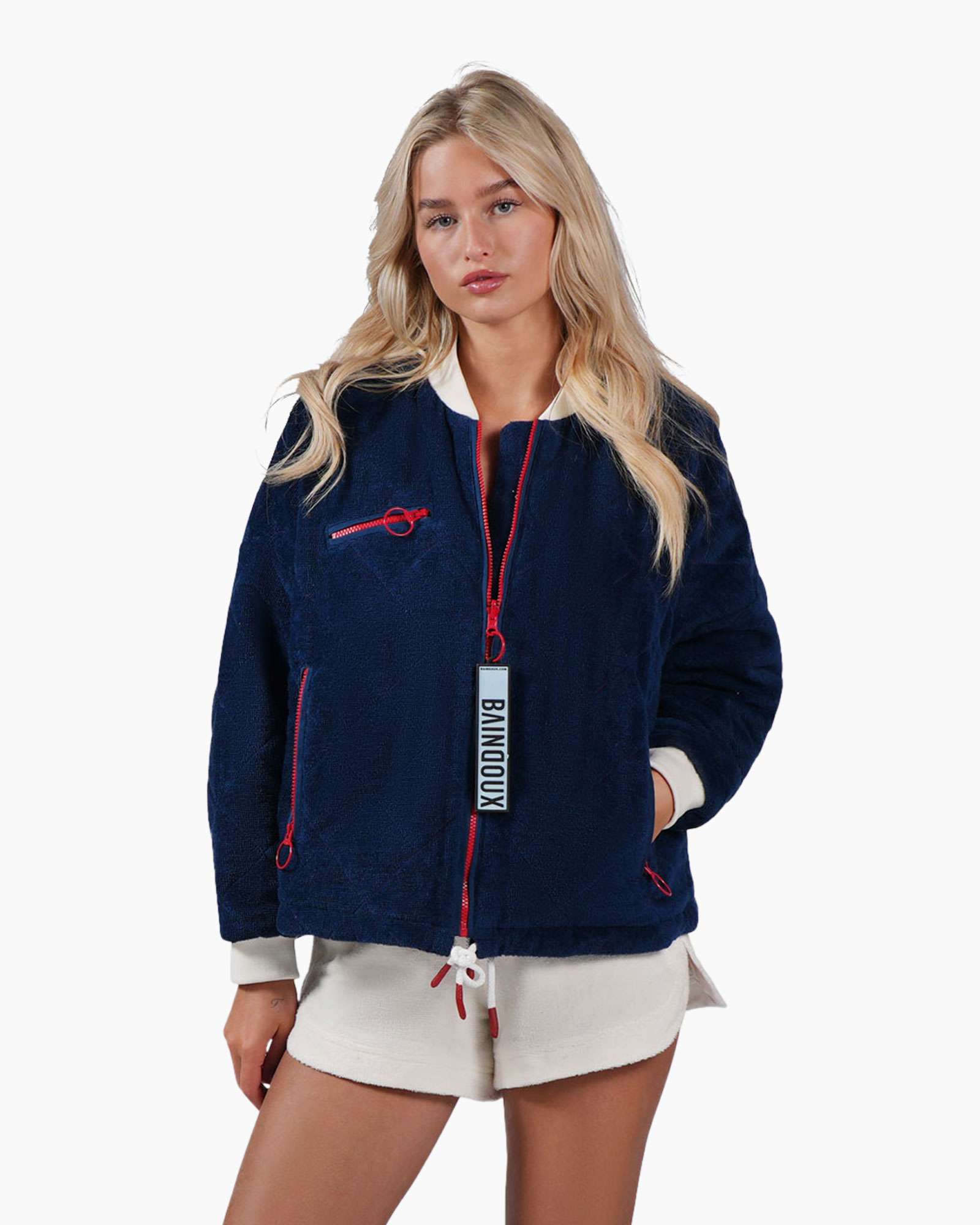 fleece jacket, navy blue, red zip, zippered pockets, drawstring hem