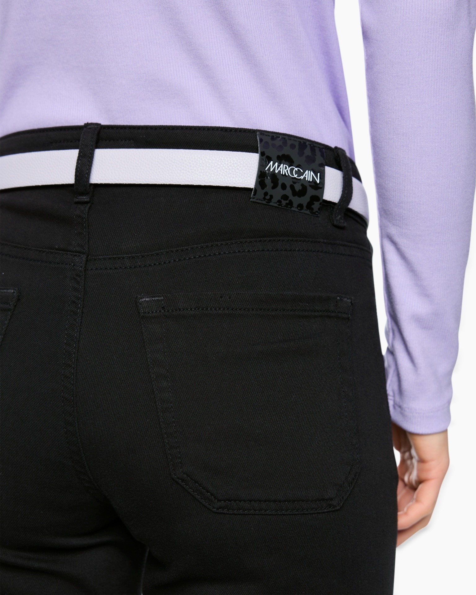 black pants, back pocket, belt loop, leather tag, white belt