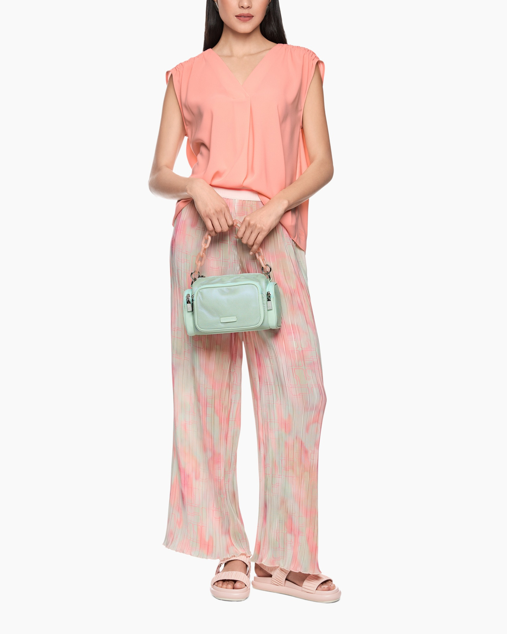 peach top, wide-leg pants, tie-dye pattern, mint handbag, sandals