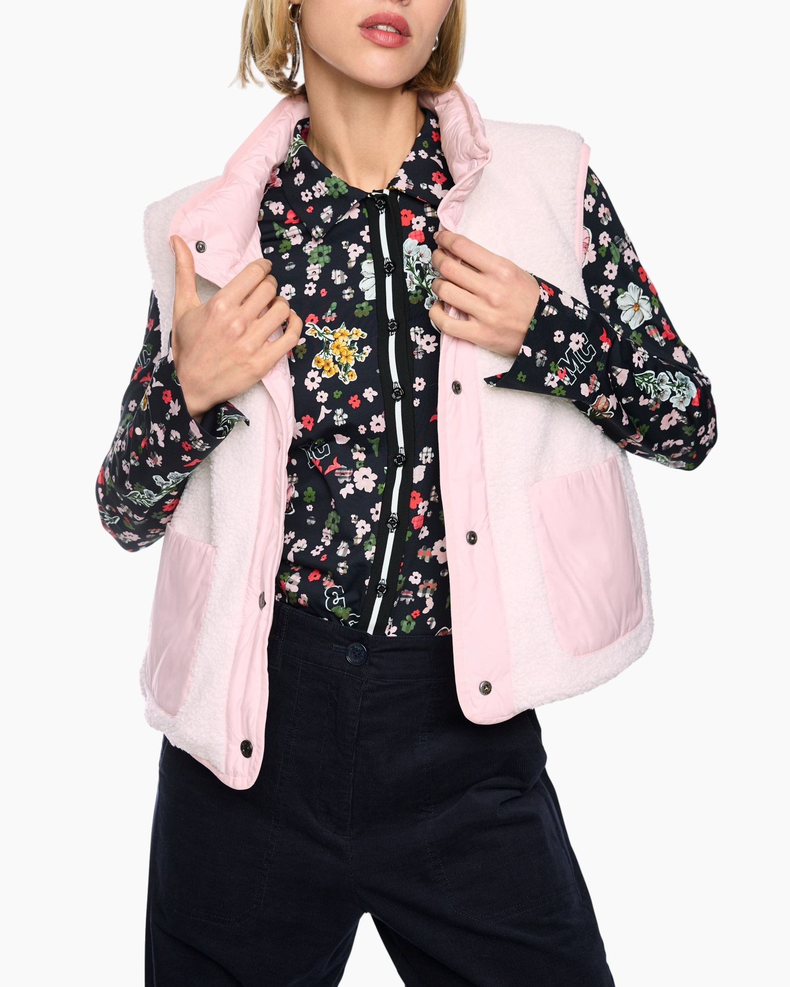 floral shirt, black blouse, puffer vest, pink vest, long sleeves, floral shirt, black background, pink vest, padded vest, layered outfit