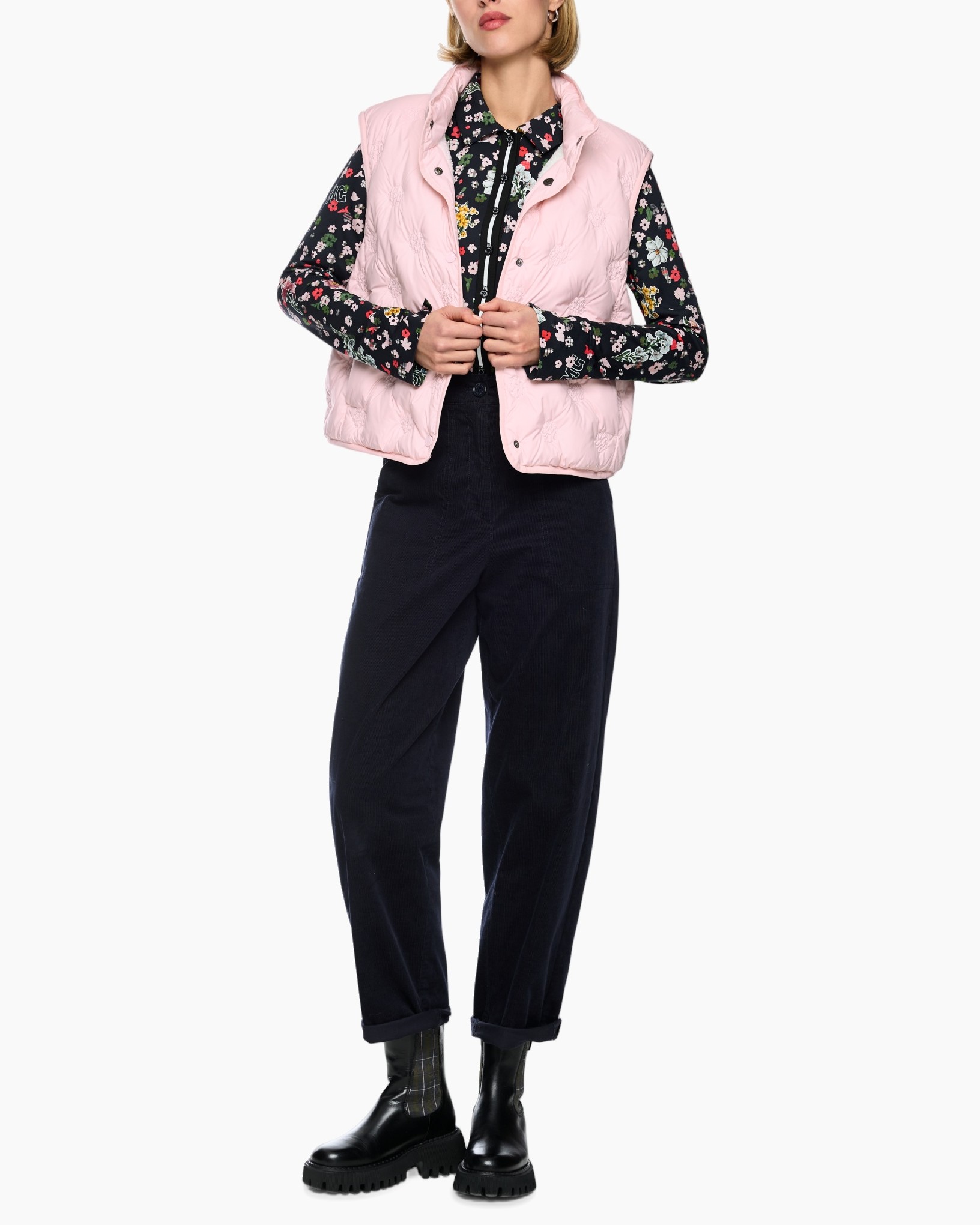 puffer vest, pink vest, outerwear, quilted, stacked collar?, pink vest, puffer vest, floral shirt, dark pants, ankle boots