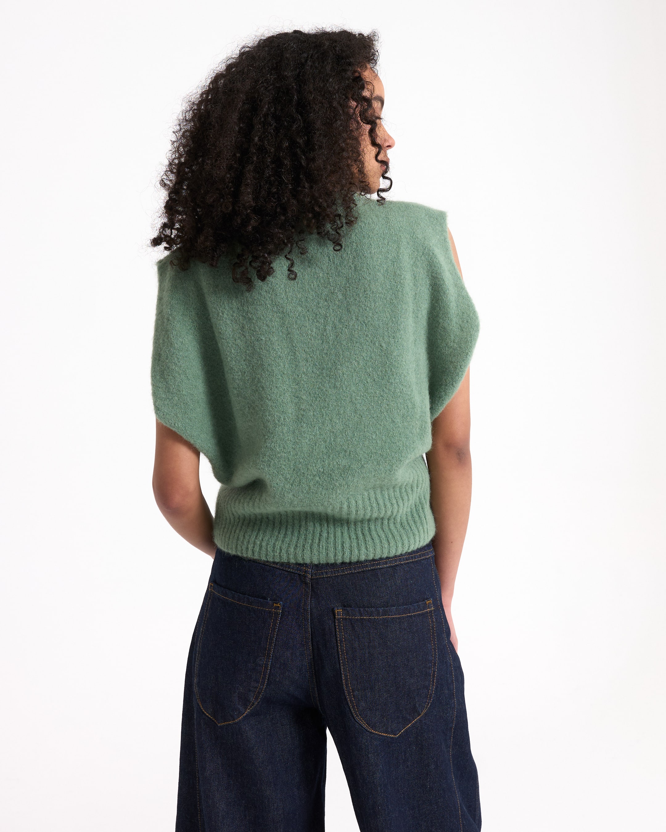 green sweater, knit vest, sleeveless sweater, ribbed hem, women’s top