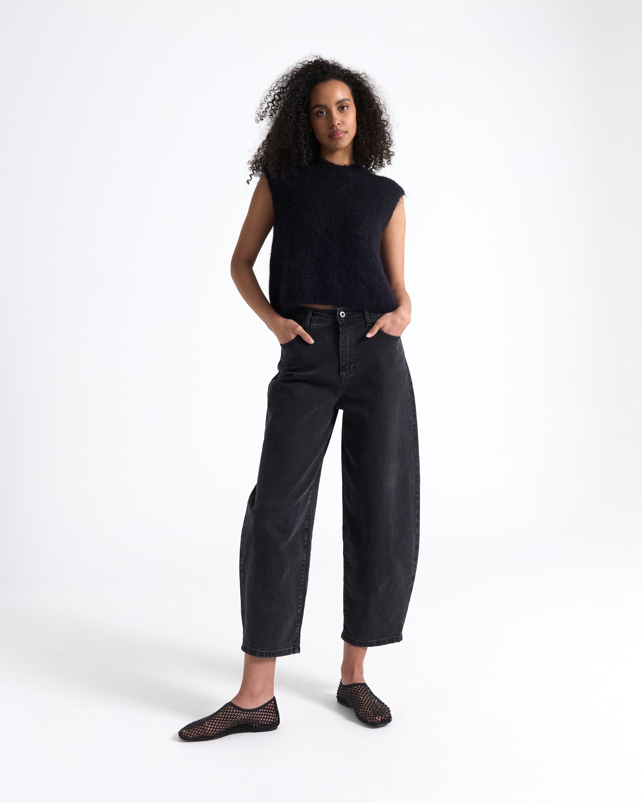 top, knit, sleeveless, black, pants, wide-leg, jeans, slip-on shoes