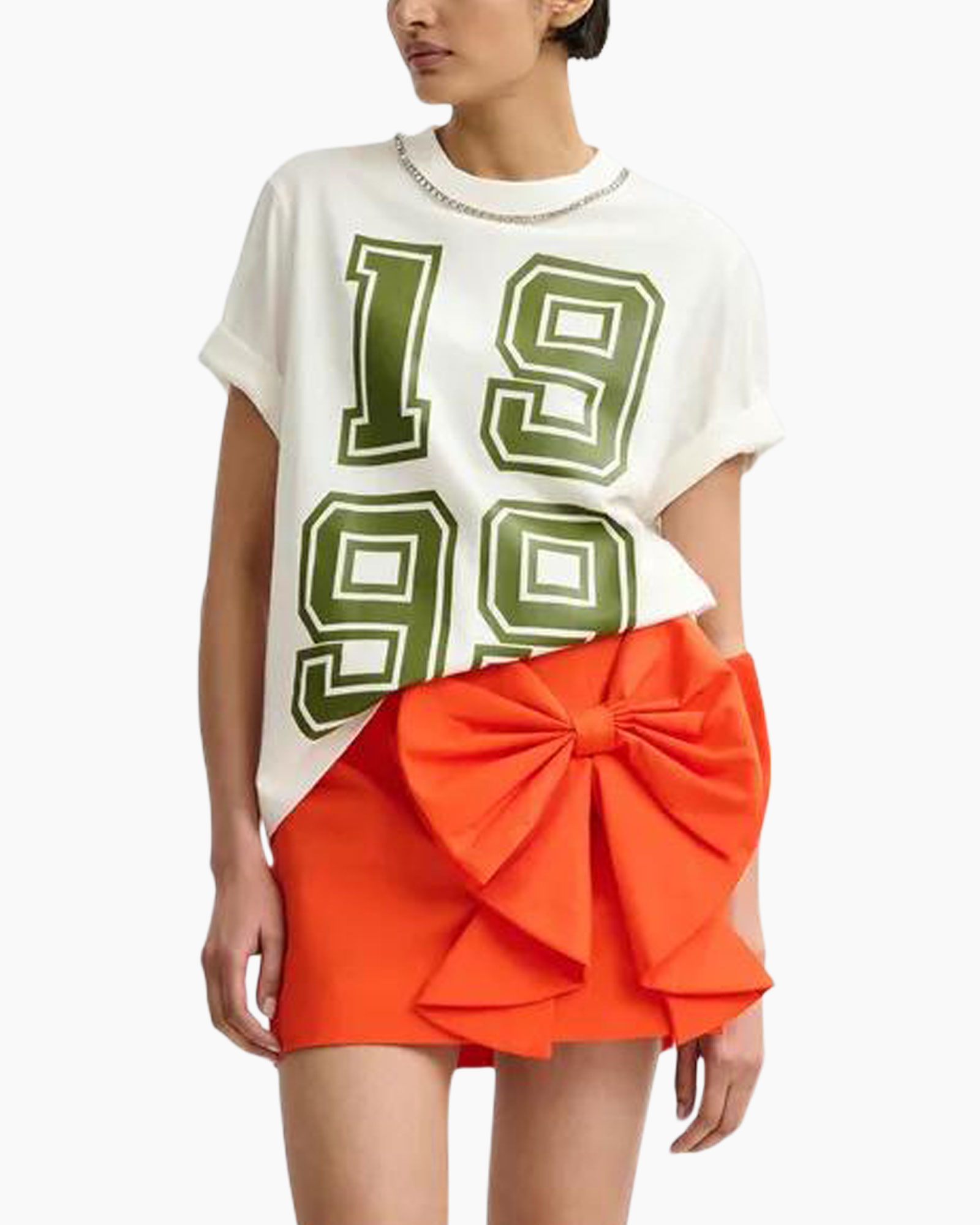 tshirt, graphic tee, linen? no (fabric not clear), orange skirt, bow detail, asymmetrical hem, shorts? wait it's a mini skirt