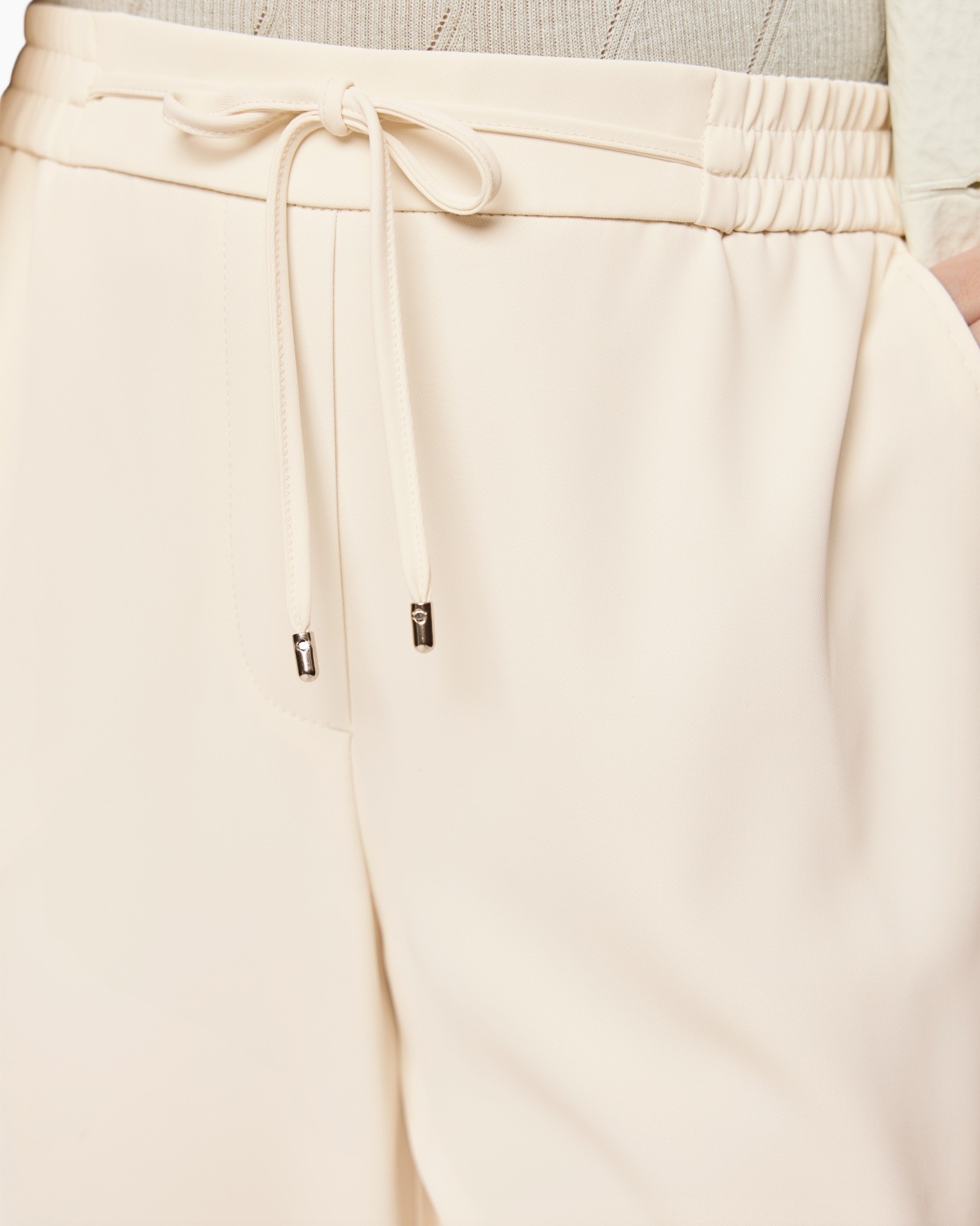 drawstring, elastic waist, beige pants, soft fabric, pocketless