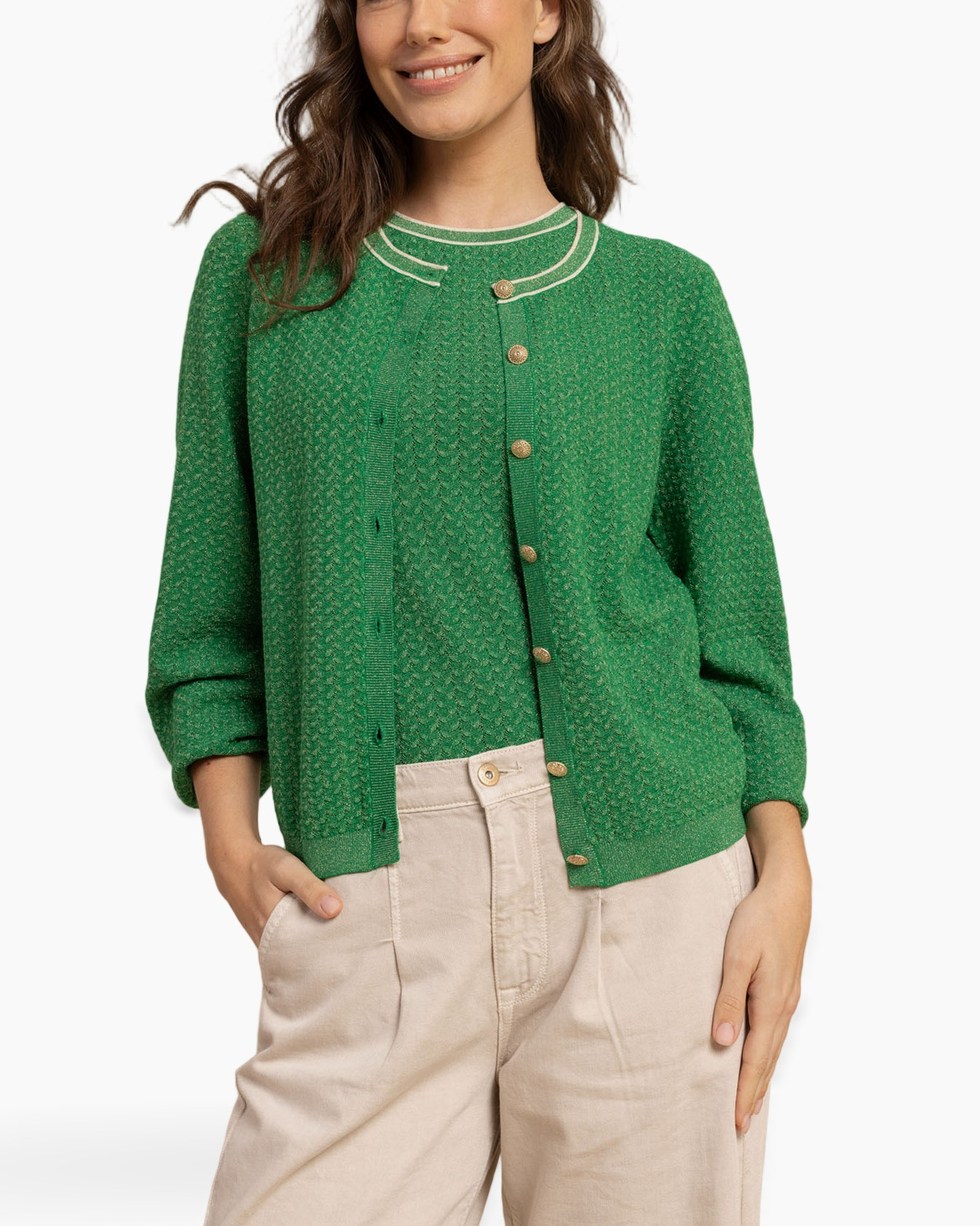 green cardigan, textured knit, gold buttons, beige pants, crew neck