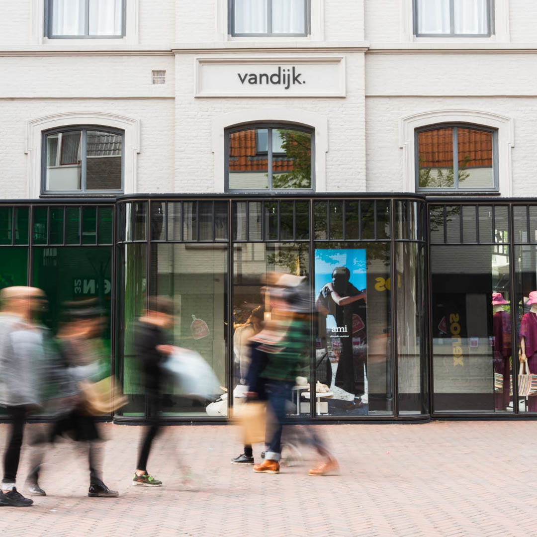 storefront, glass facade, pedestrian street, retail display, signage