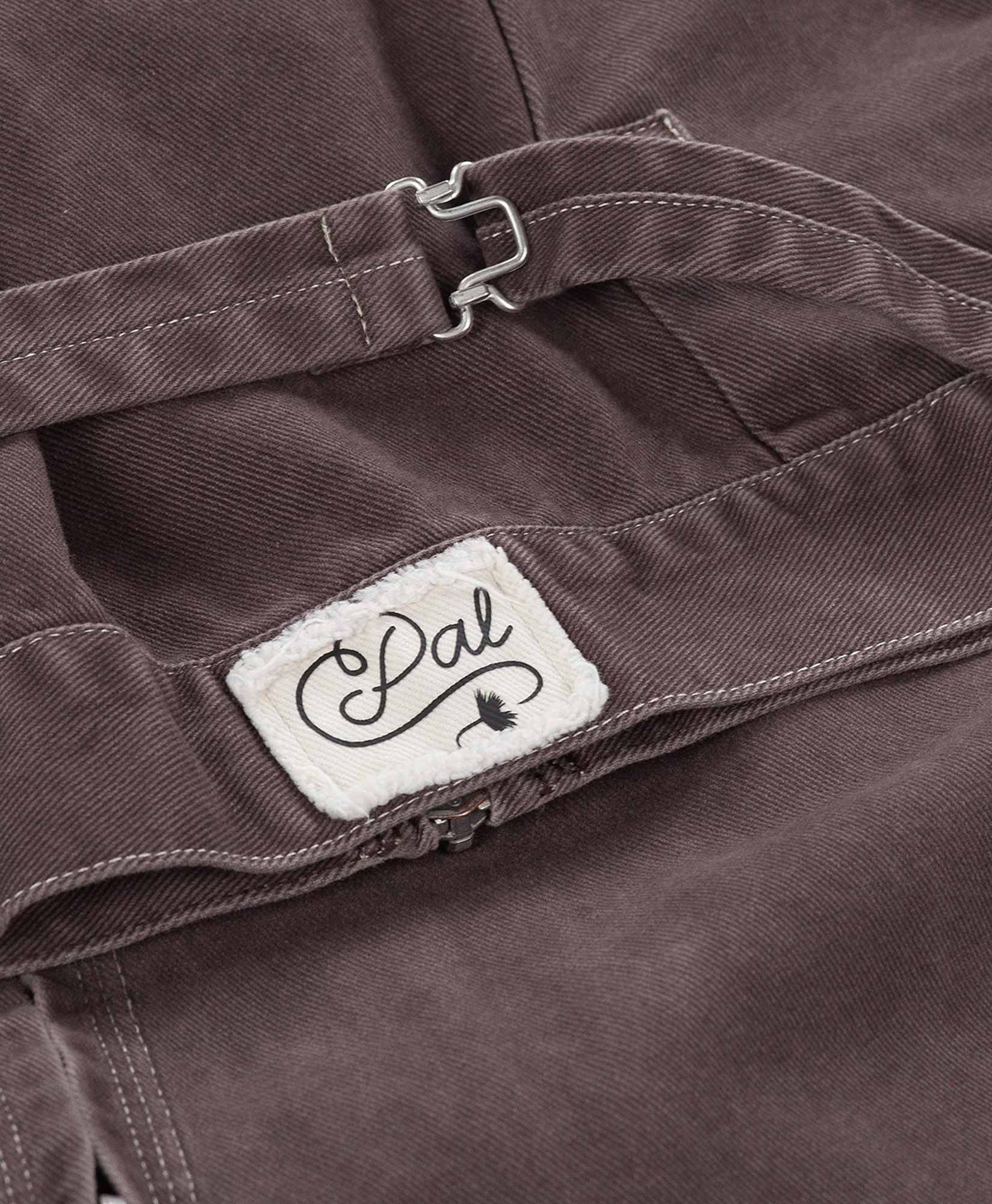 cord, clasp, patch, belt, brown pants