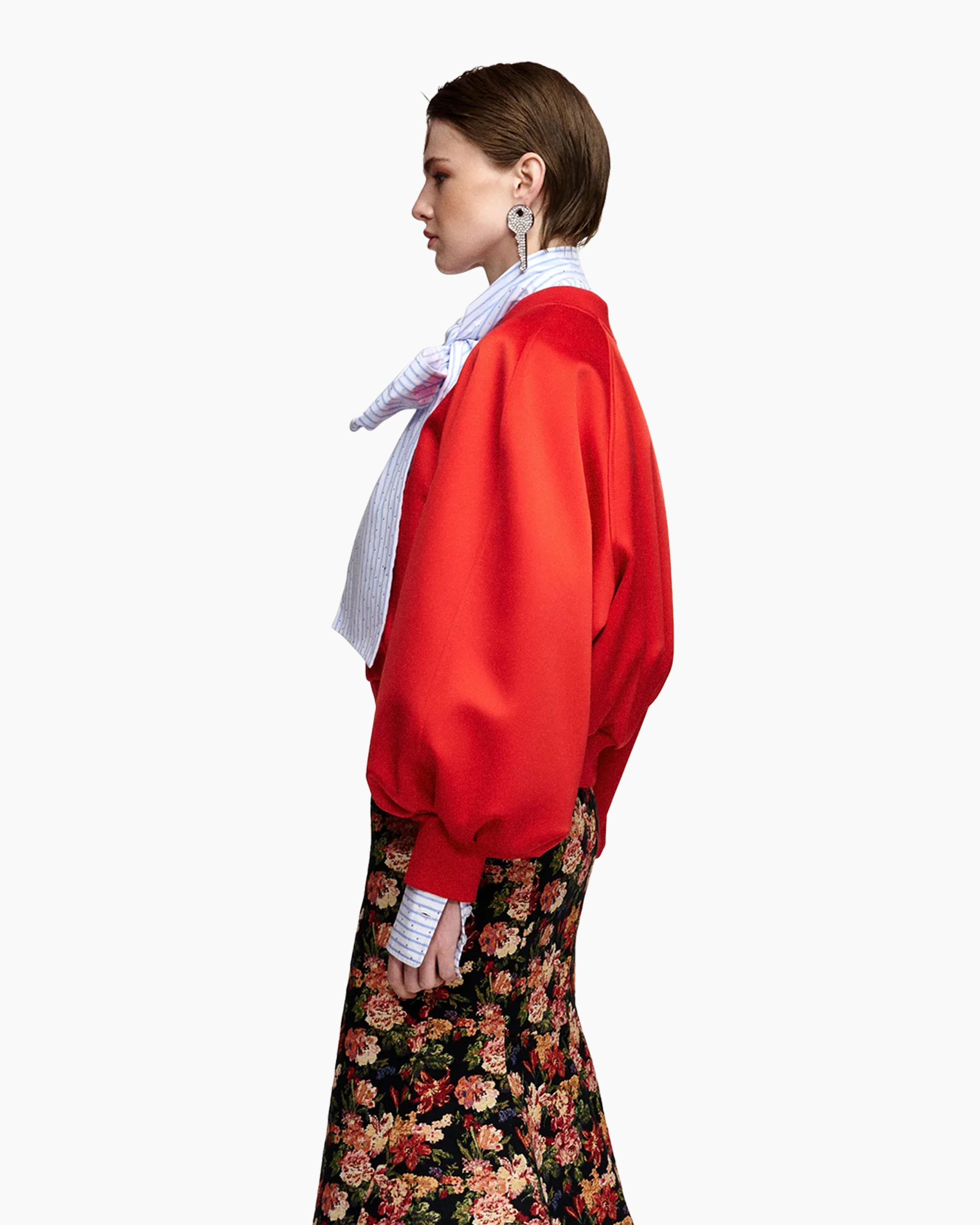 red sweater, bomber jacket, scarf, floral skirt, earrings