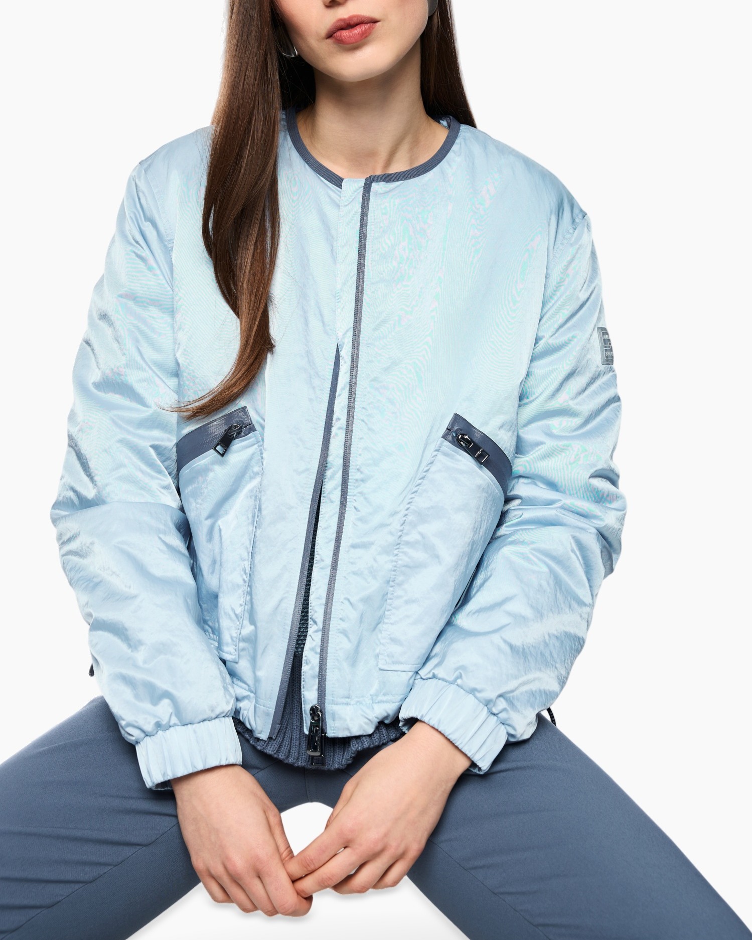light blue jacket,  bomber jacket, zipper, pockets, elastic cuffs