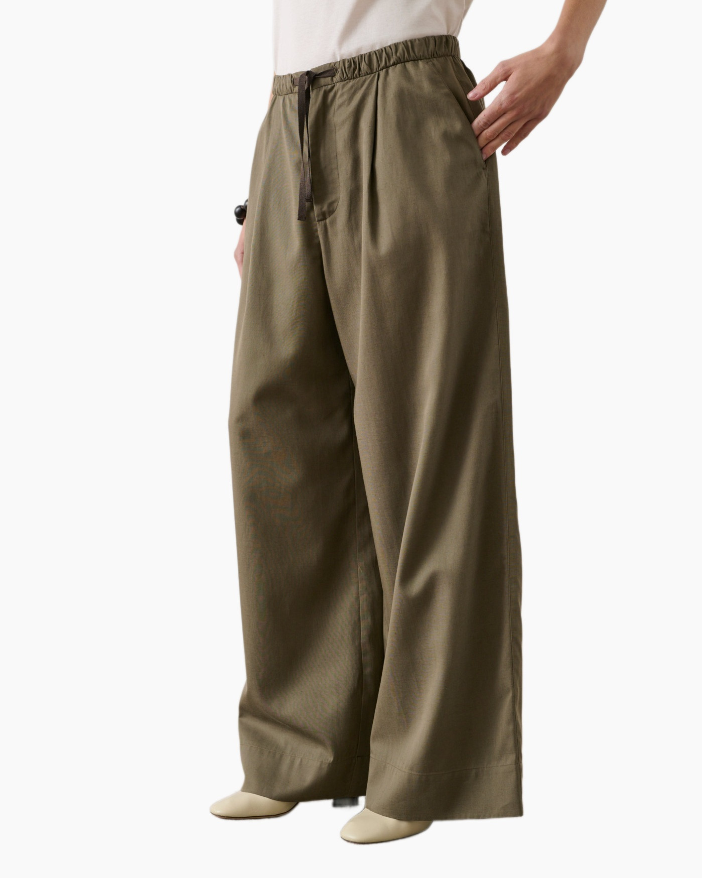 Clothing, Pants, Coat, Person, Khaki