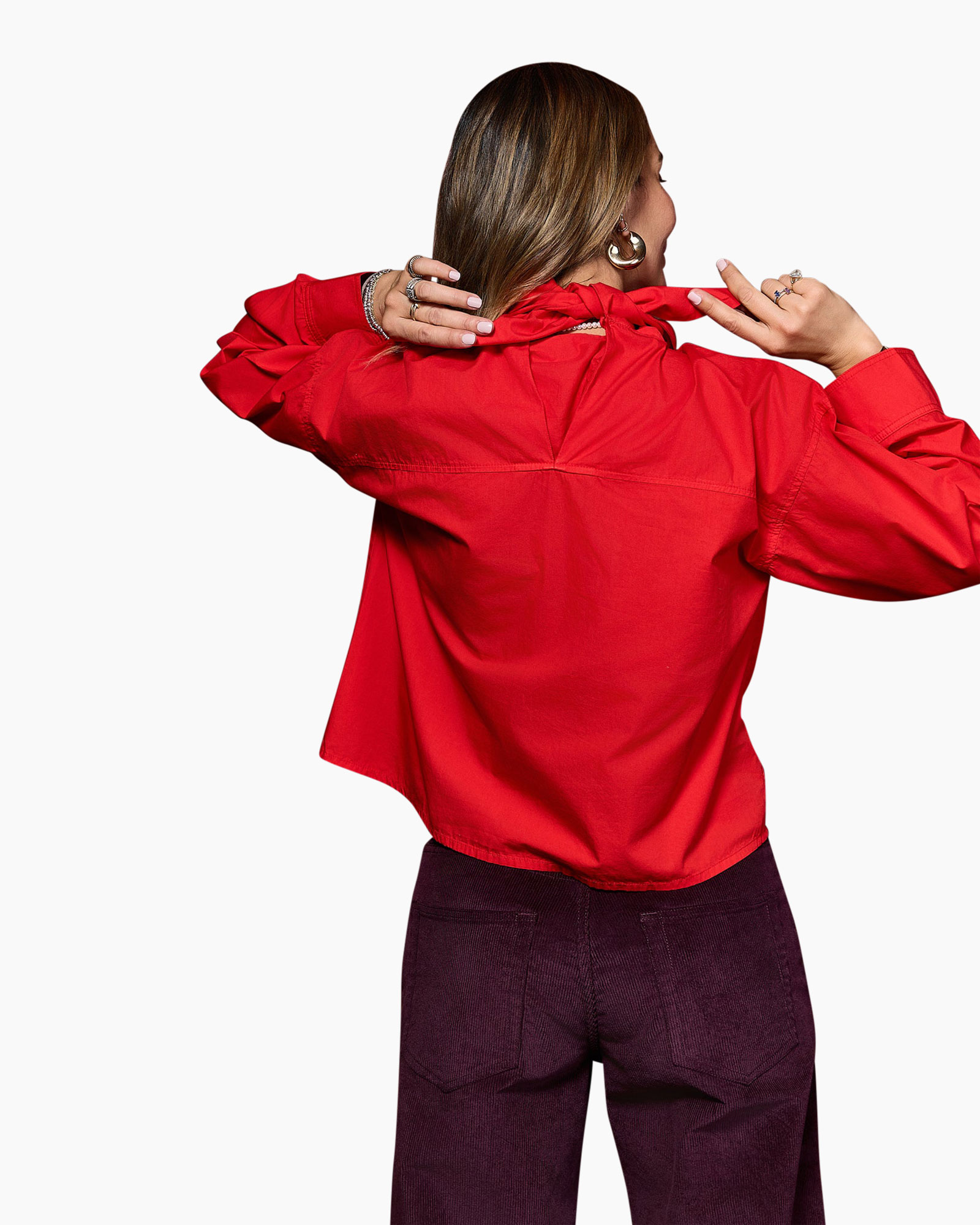 red blouse, long sleeves, collared shirt, woven fabric, solid color