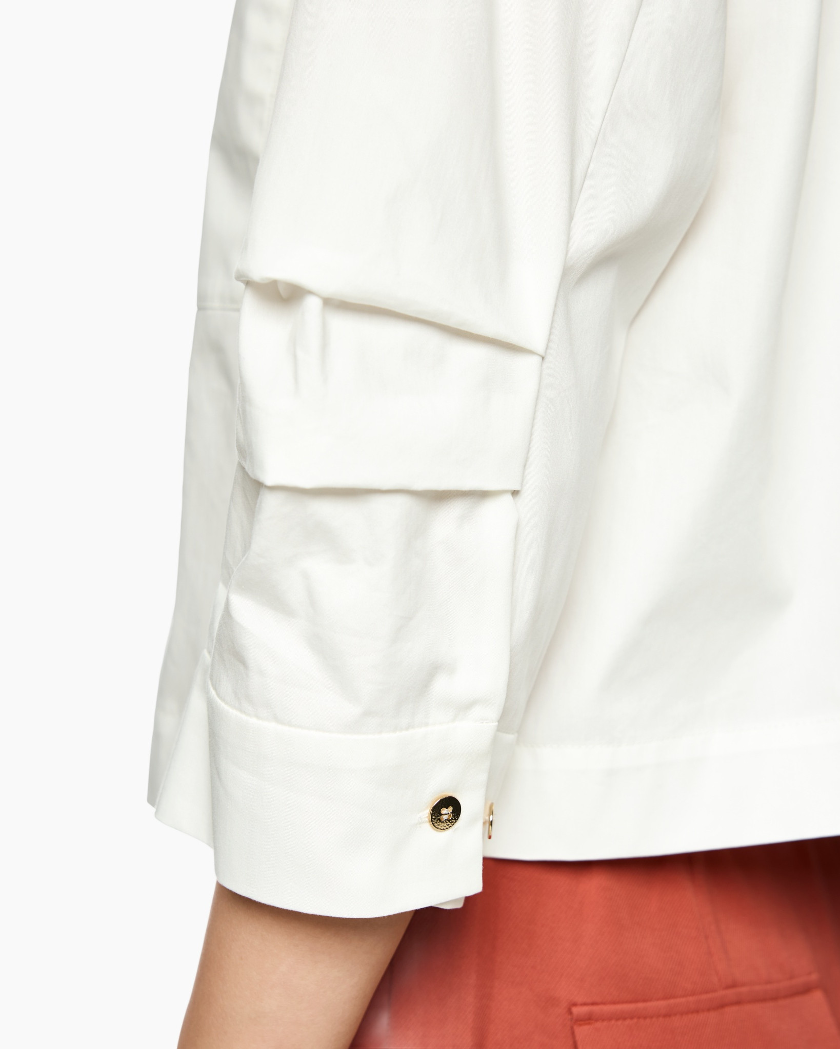 white shirt, long sleeve, gold button, cuff detail, pocketless