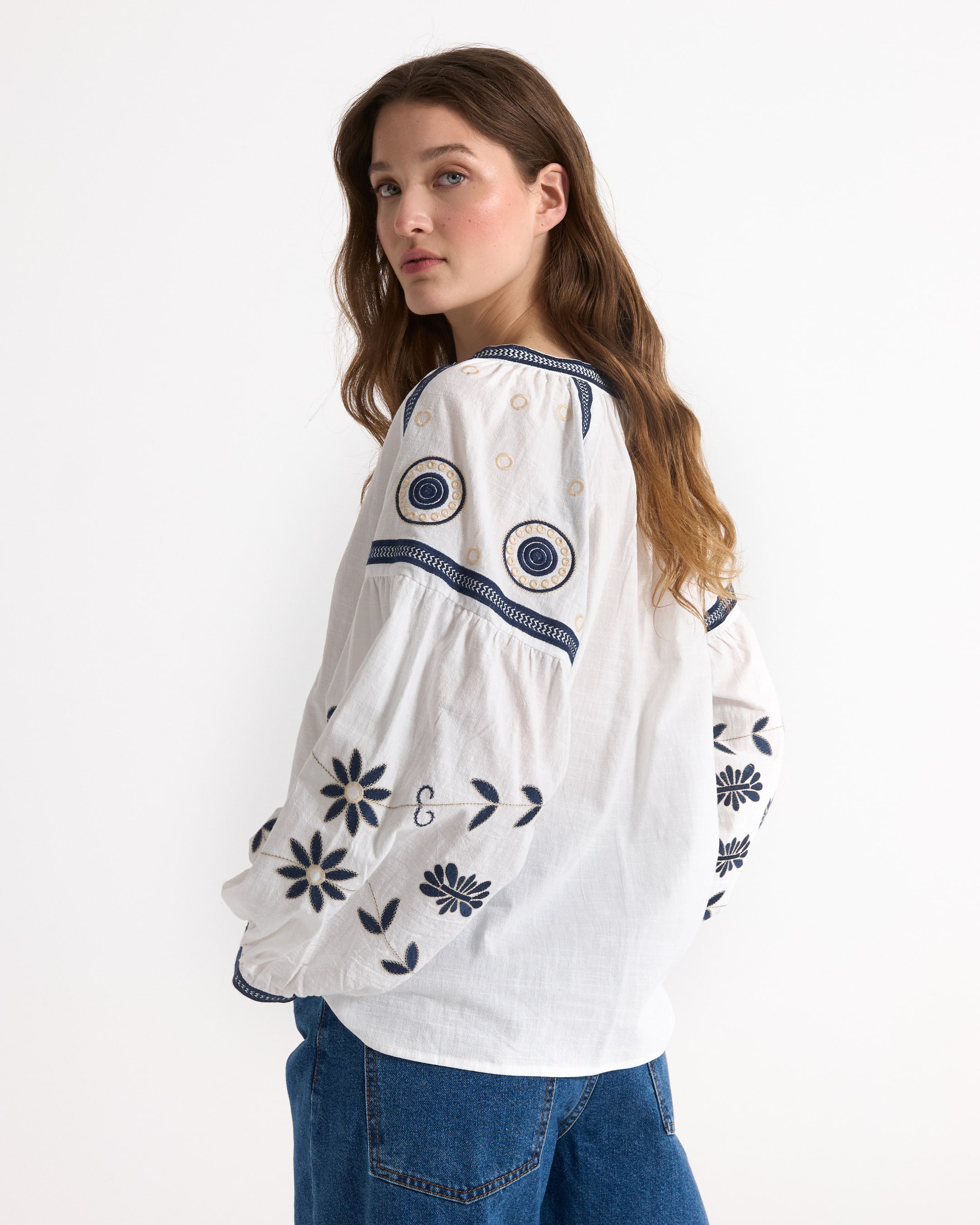 white blouse, embroidered floral, blue embroidery, loose fit, round neckline