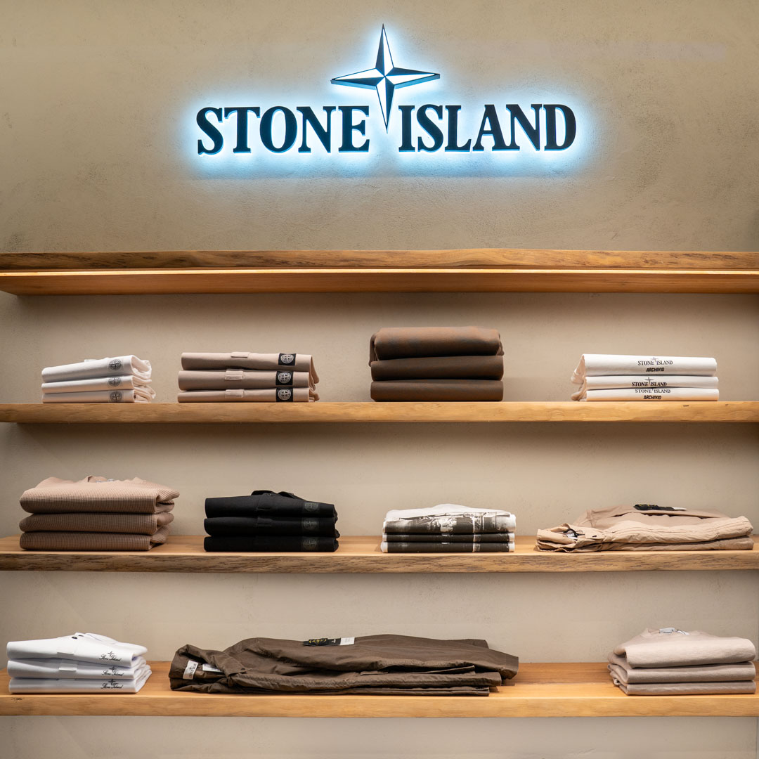 clothing, sweaters, folded, neutral-toned, shelf-display