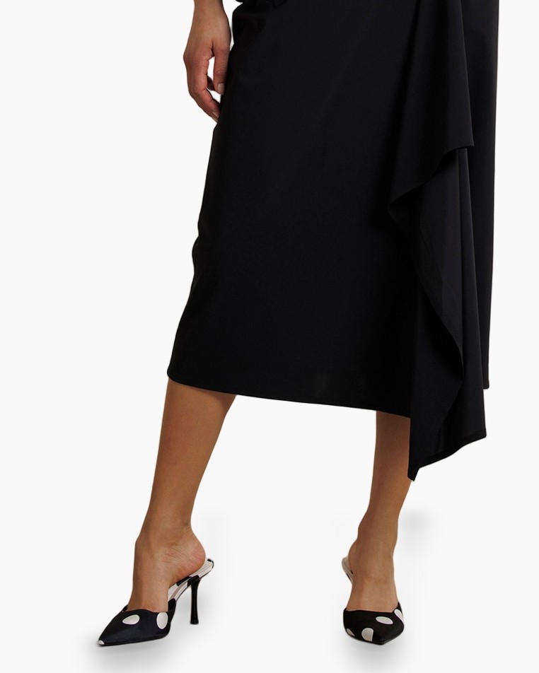 black dress, midi length, asymmetric hem, slip-on heels, polka dots