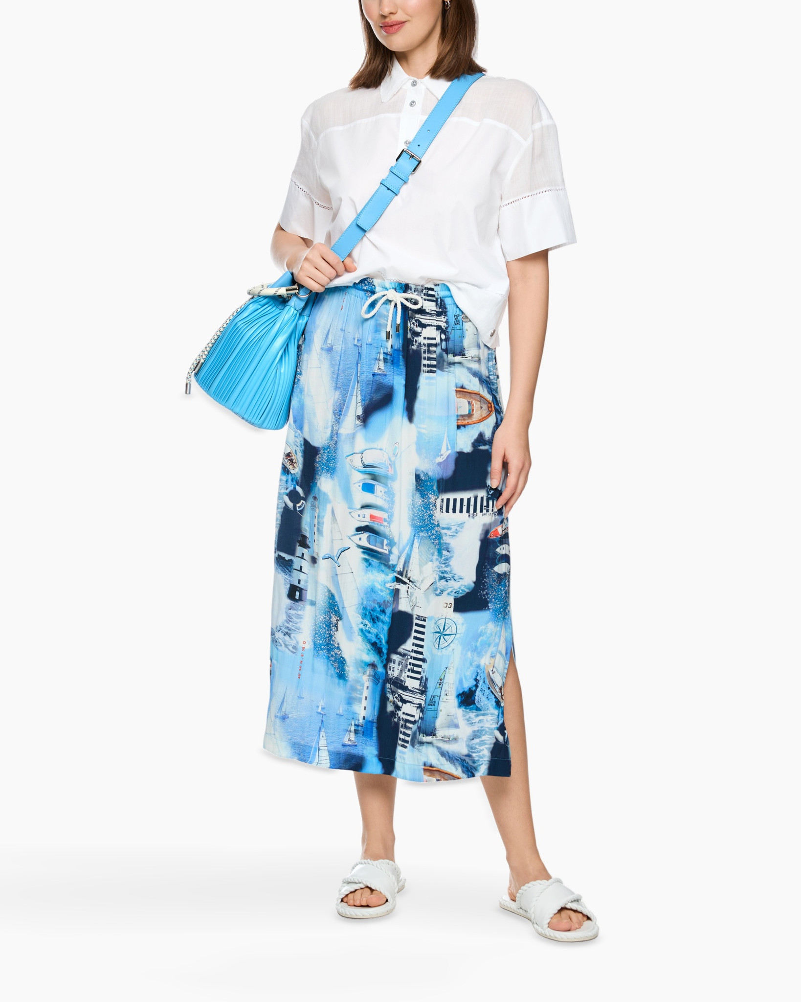white shirt, blue skirt, printed skirt, crossbody bag, sandals