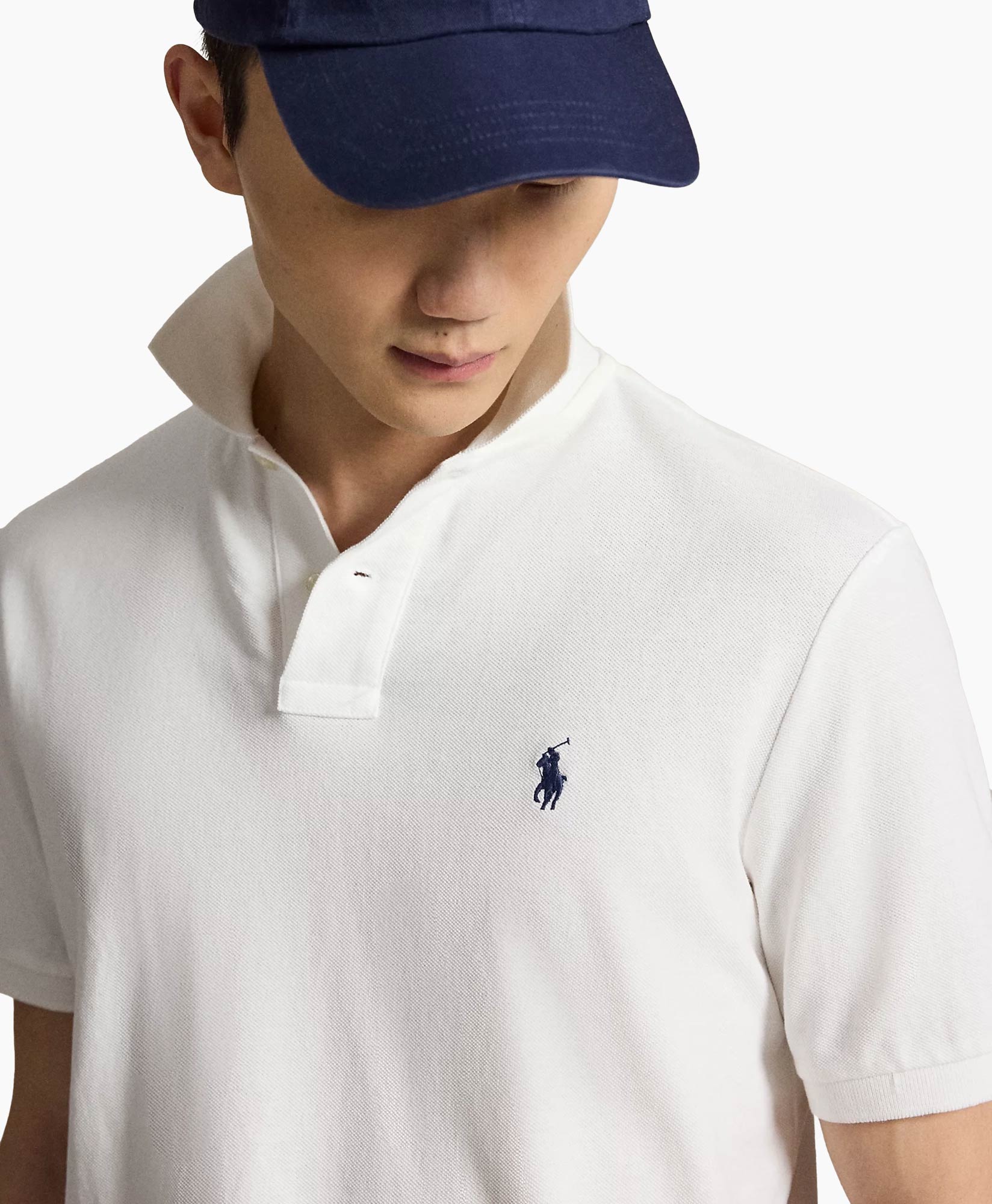 white polo, polo shirt, collared shirt, embossed logo, short sleeve