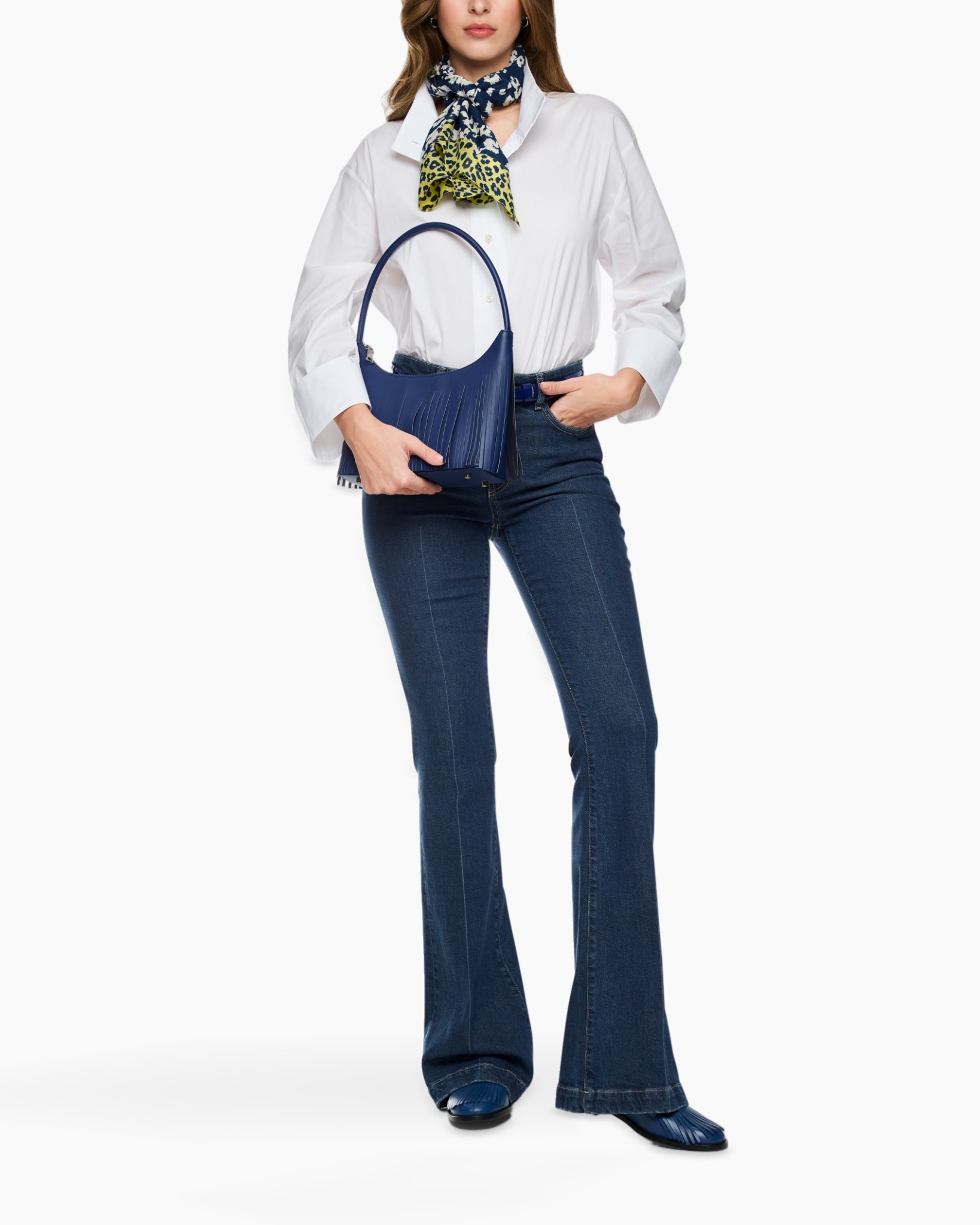 white shirt, flare jeans, blue handbag, scarf accessory, ankle boots