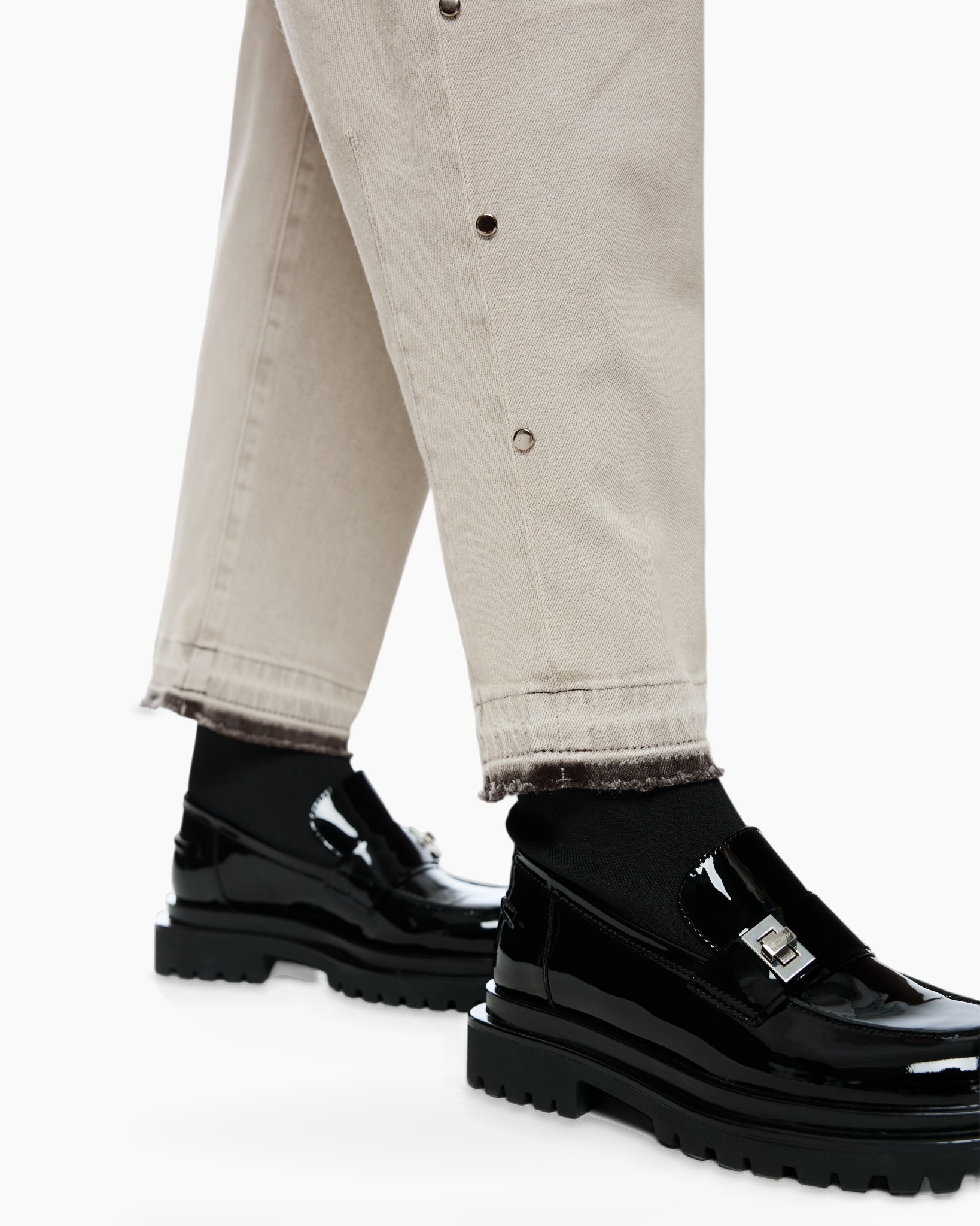 beige pants, slit side, button tab, tapered hem, black loafers