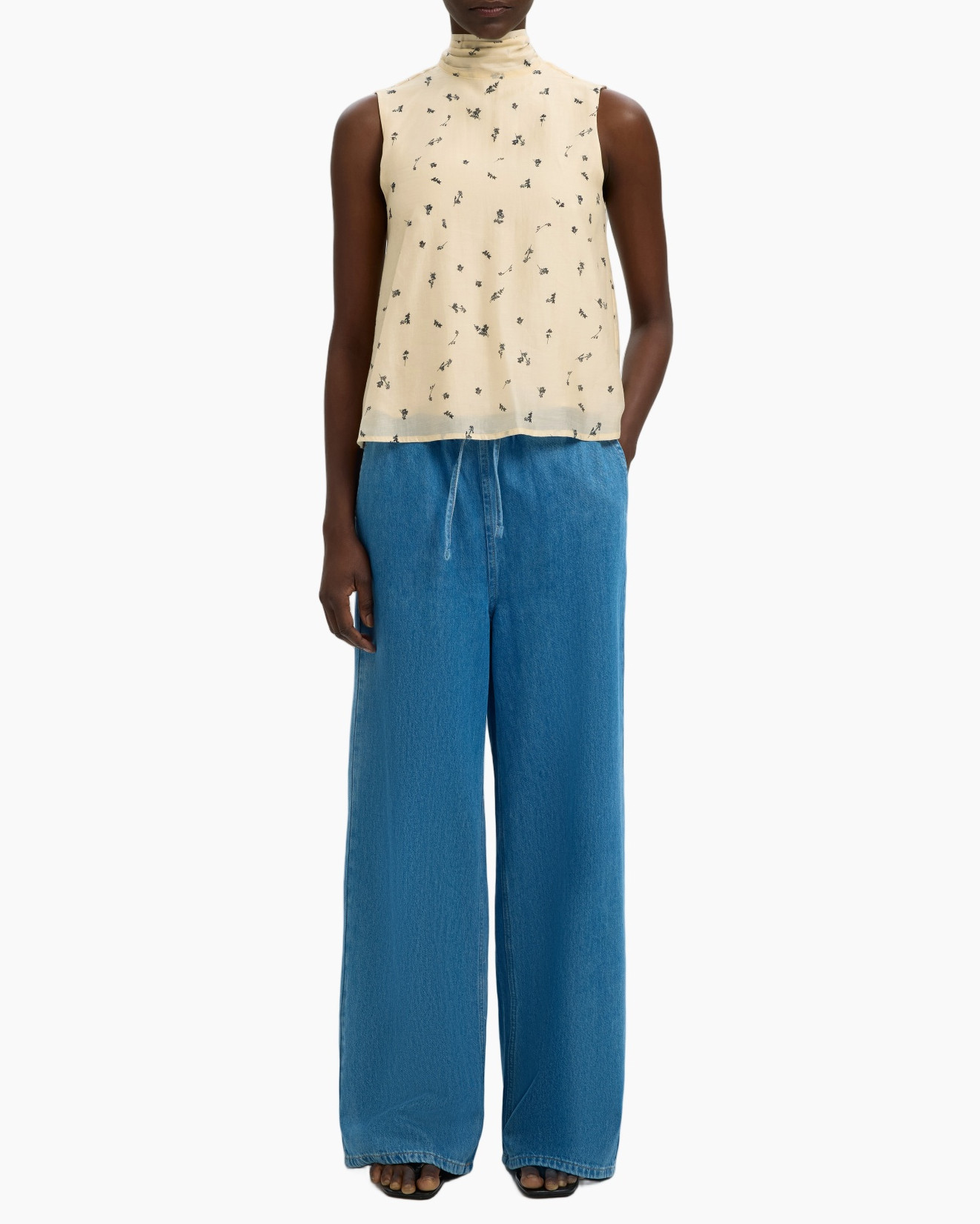 sleeveless top, high neck, cream floral, midweight fabric, wide-leg jeans