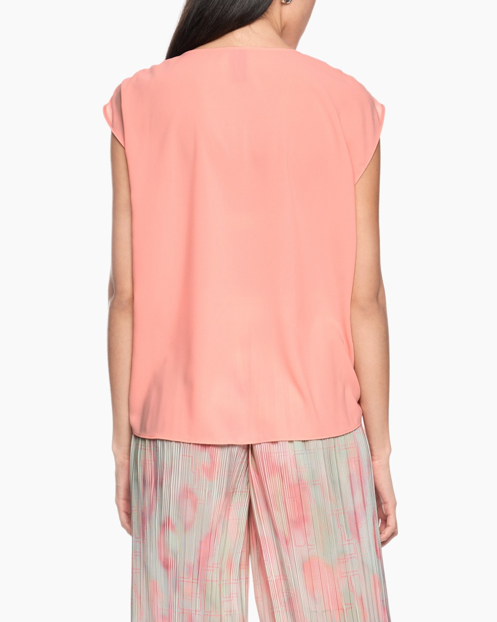 peach top, short sleeves, soft fabric, loose fit, back view