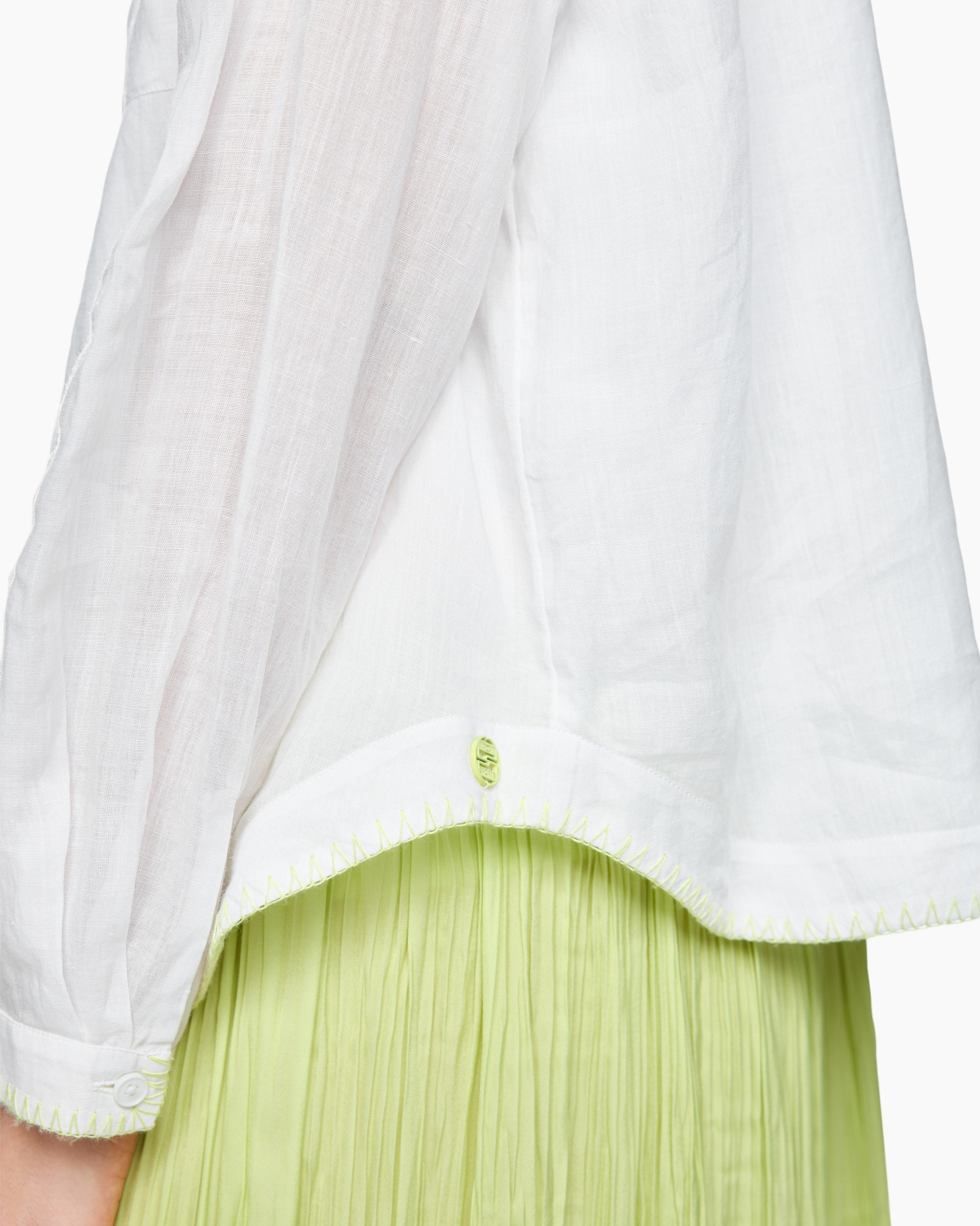 white fabric, linen, collar edge, neon green hem, pleated skirt