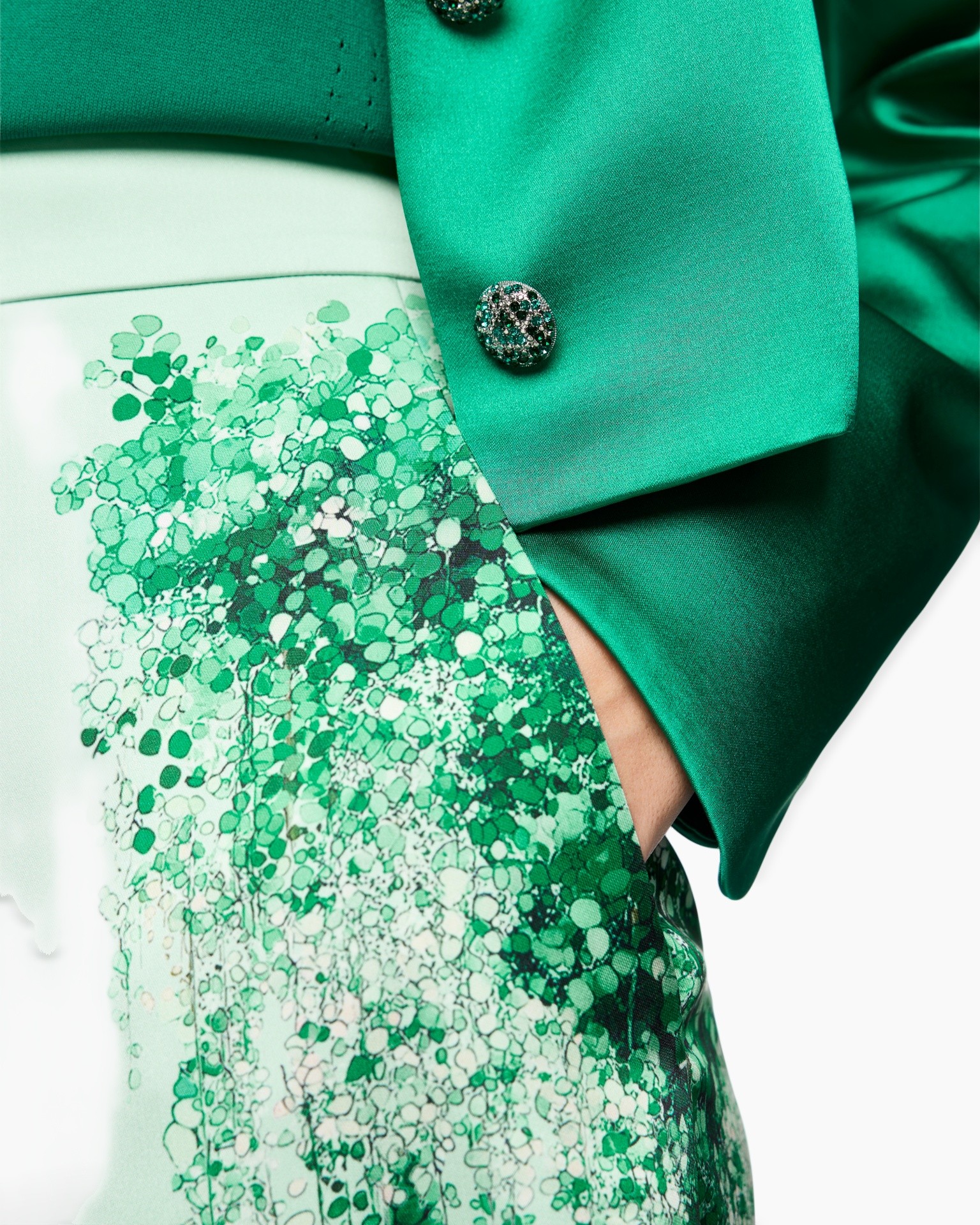green, green blazer, decorative buttons, patterned fabric, sleek sleeve