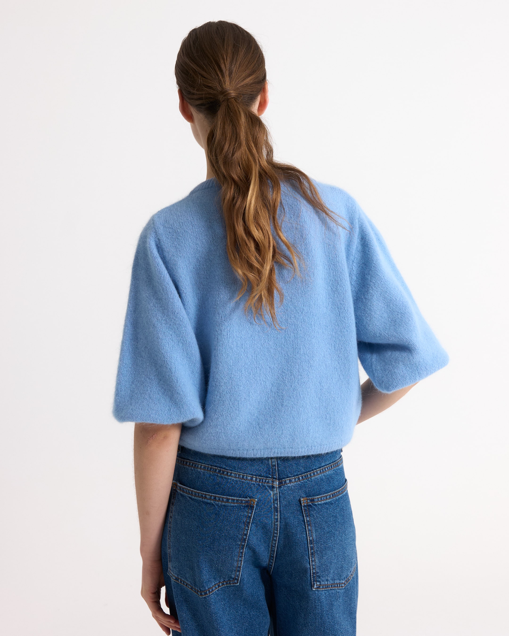 blue sweater, soft knit, short sleeve, loose fit, back view