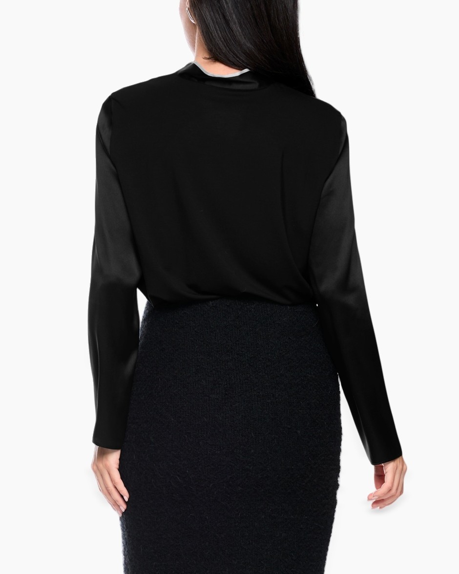 black top, long sleeves, silk sleeves, black skirt, back view