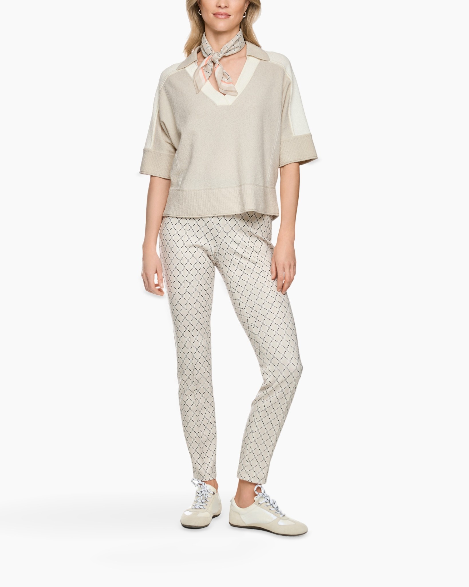 beige sweater, V-neck, short sleeves, patterned pants, scarf accessory