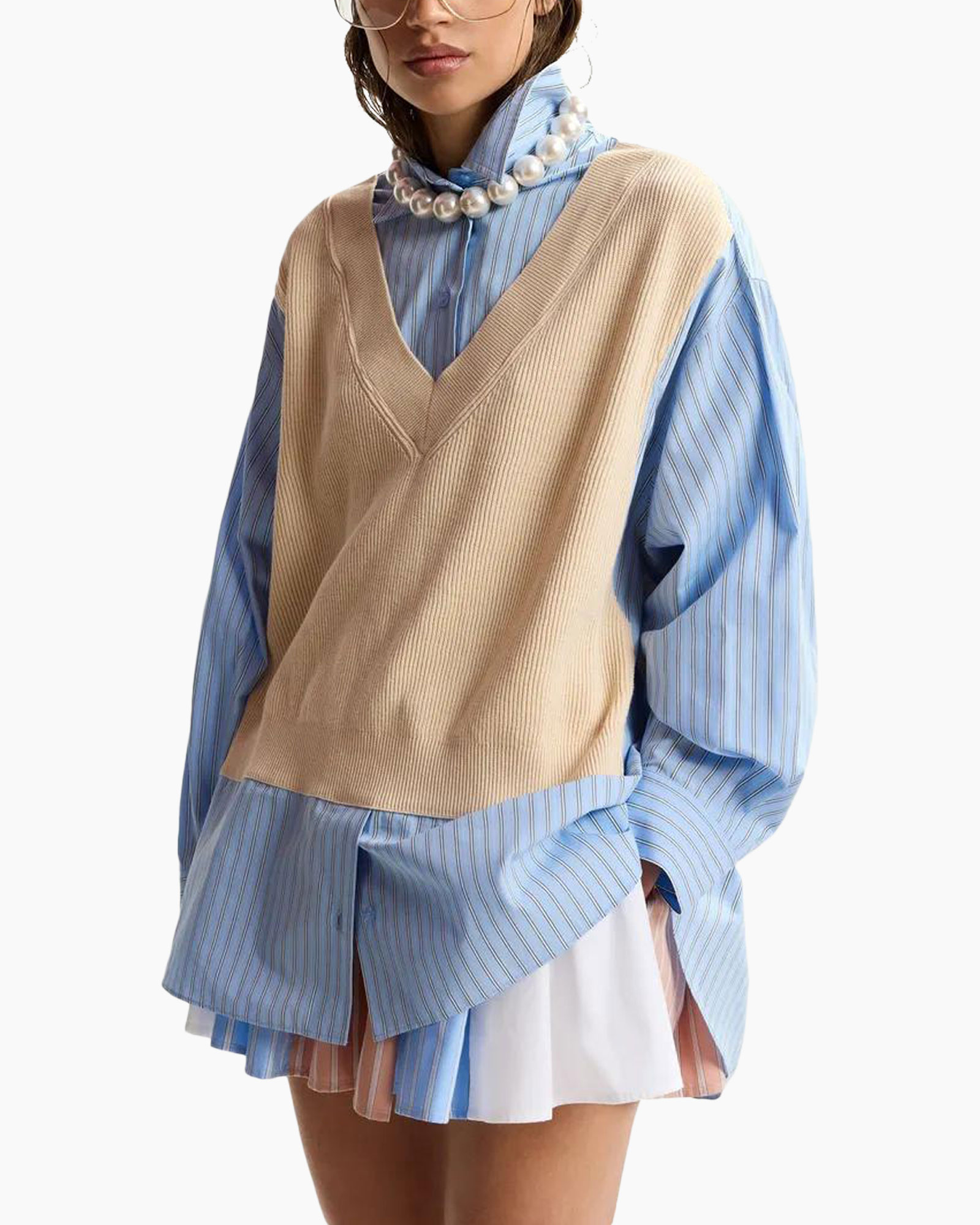 striped shirt, beige vest, layered outfit, pearls necklace, oversized sweater vest