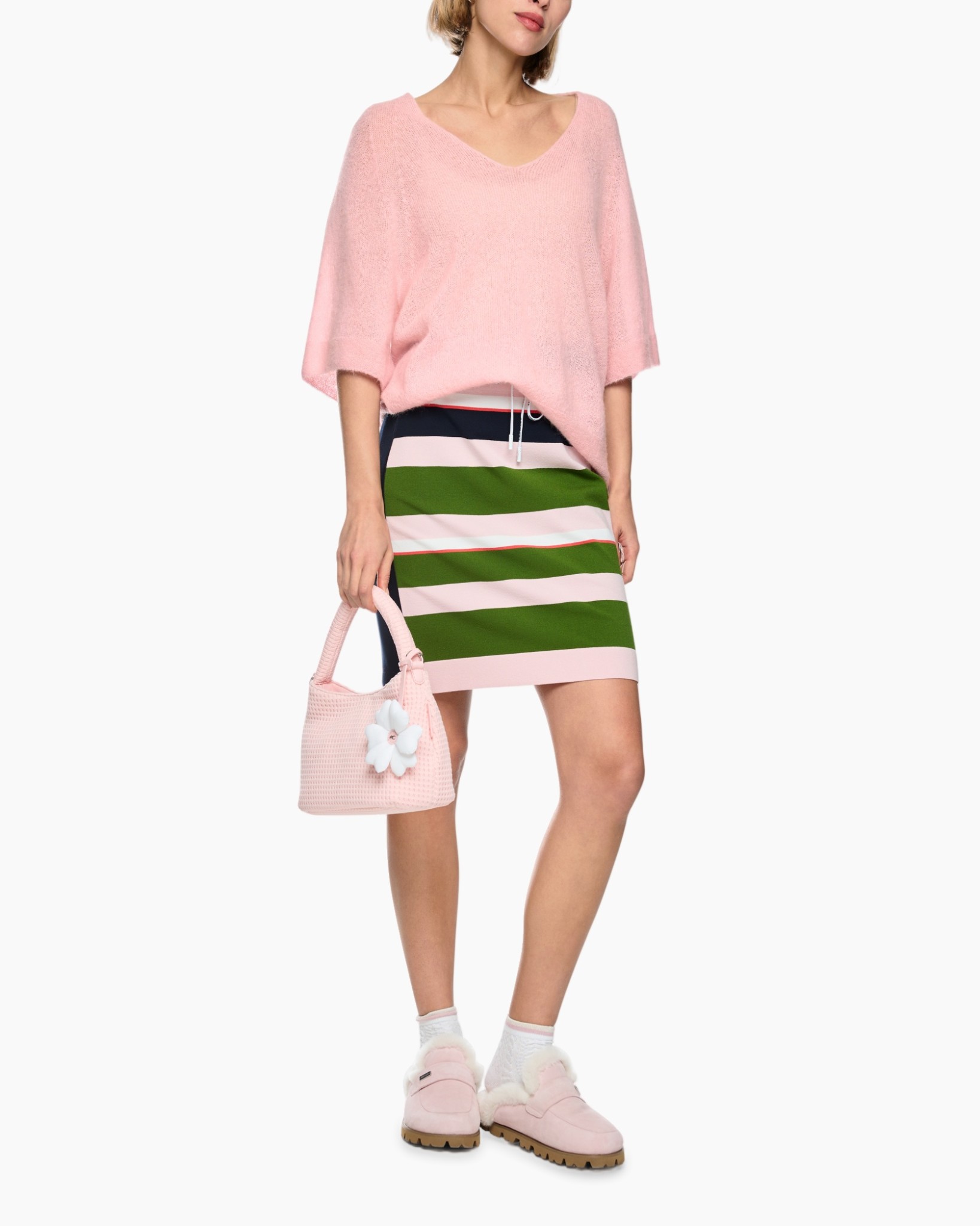 pink sweater, loose knit, pink handbag, striped skirt, pink sneakers