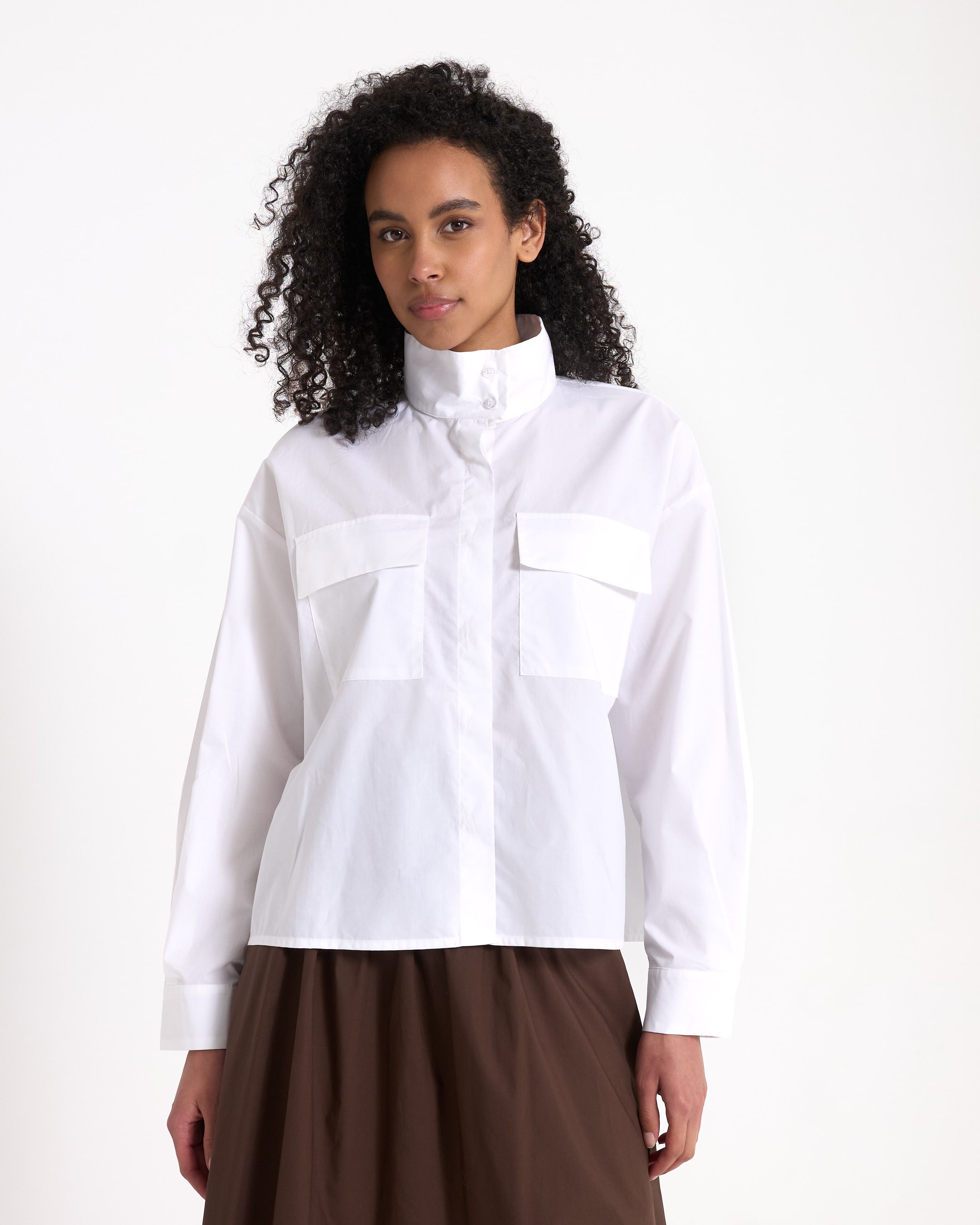 white shirt, buttoned collar, cargo pockets, long sleeves, casual top
