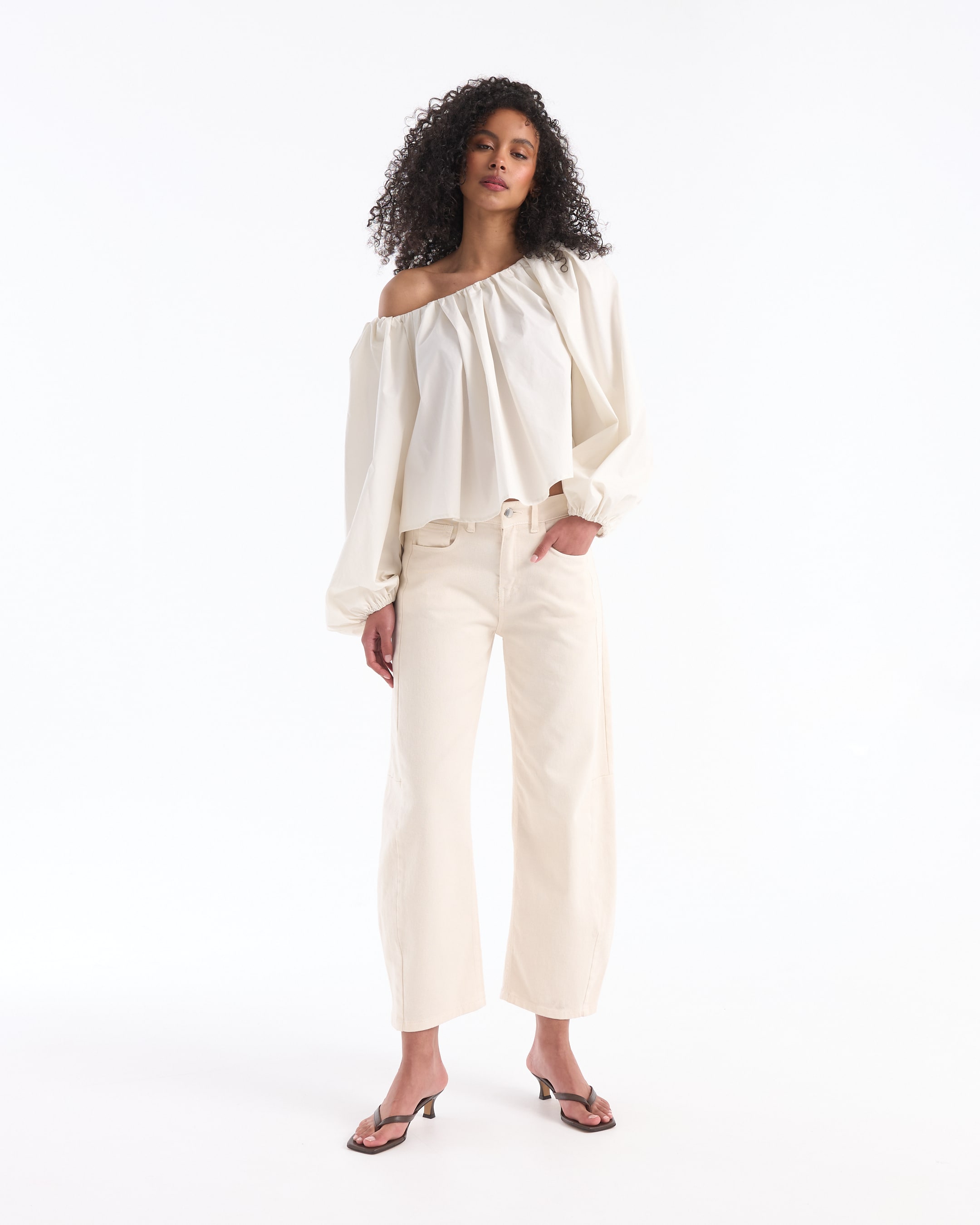 off-shoulder top, cream blouse, loose fit, high-waisted jeans, sandals