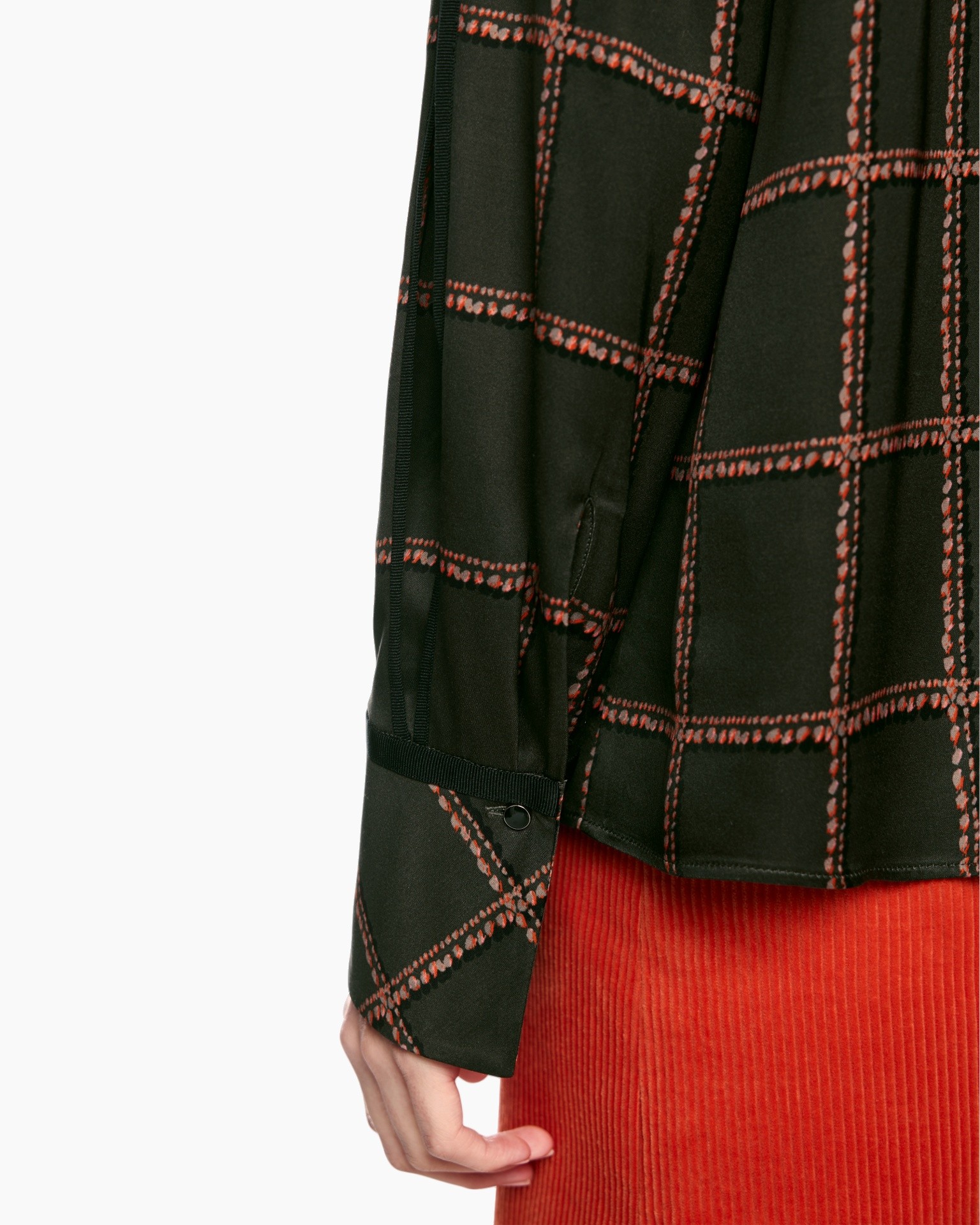 black plaid, checkered pattern, long sleeve, buttoned cuff, red skirt