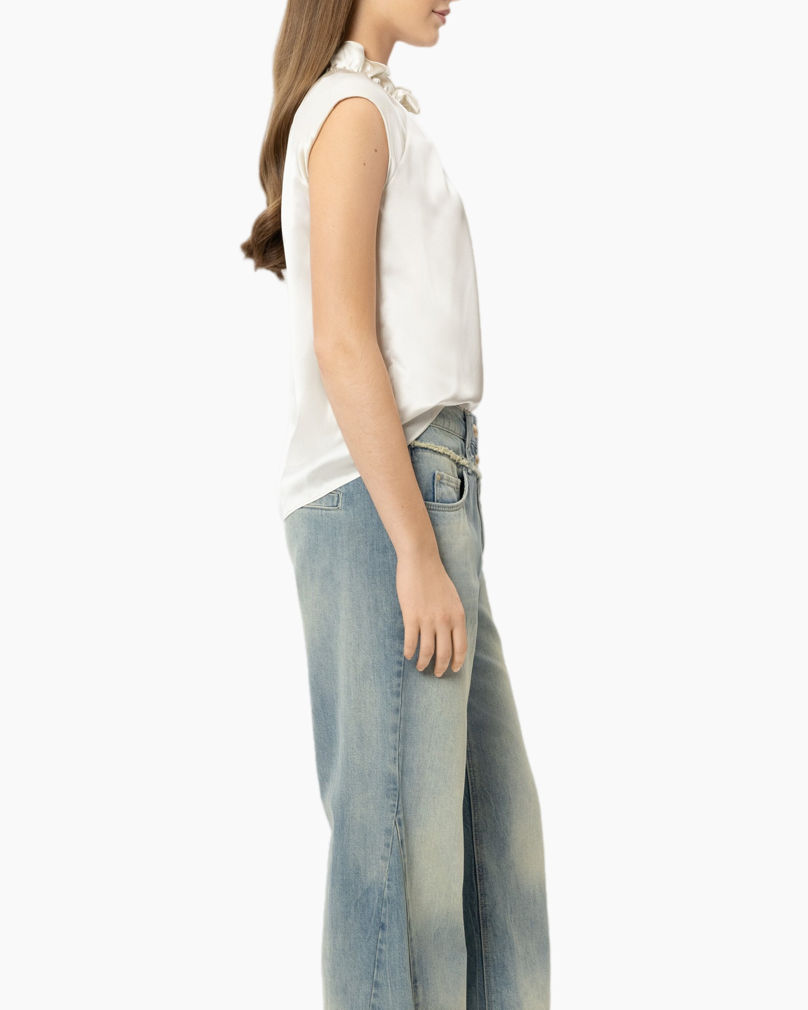 white blouse, sleeveless top, ruffled collar, toned jeans, light wash denim