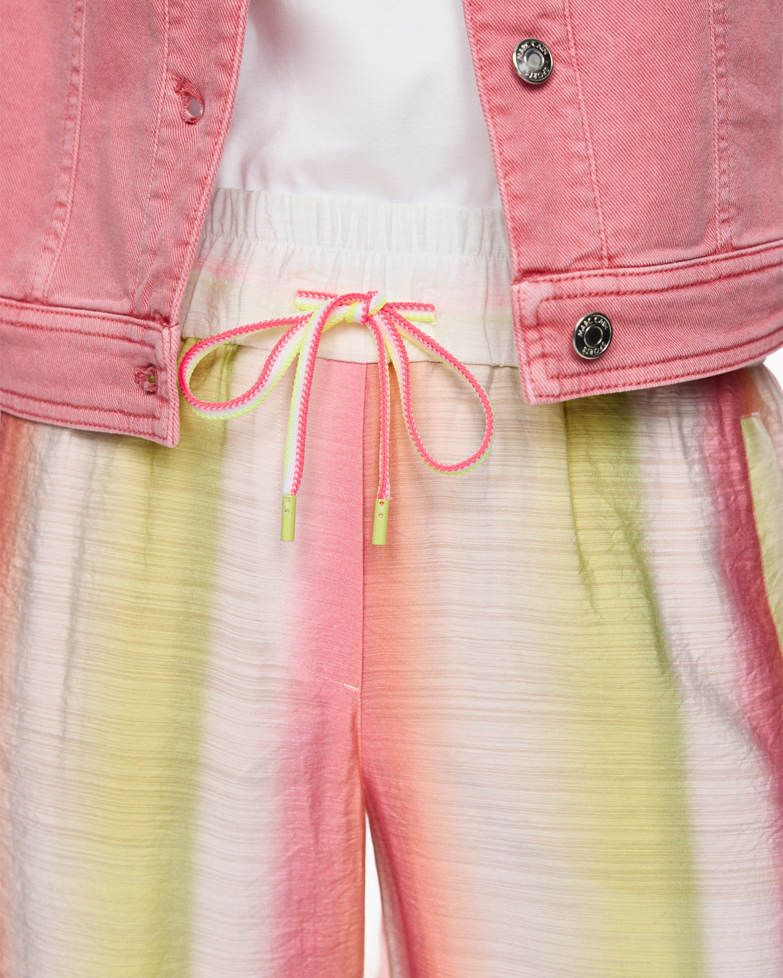 pink jacket, drawstring, tie-dye pants, elastic waist, metal snap buttons