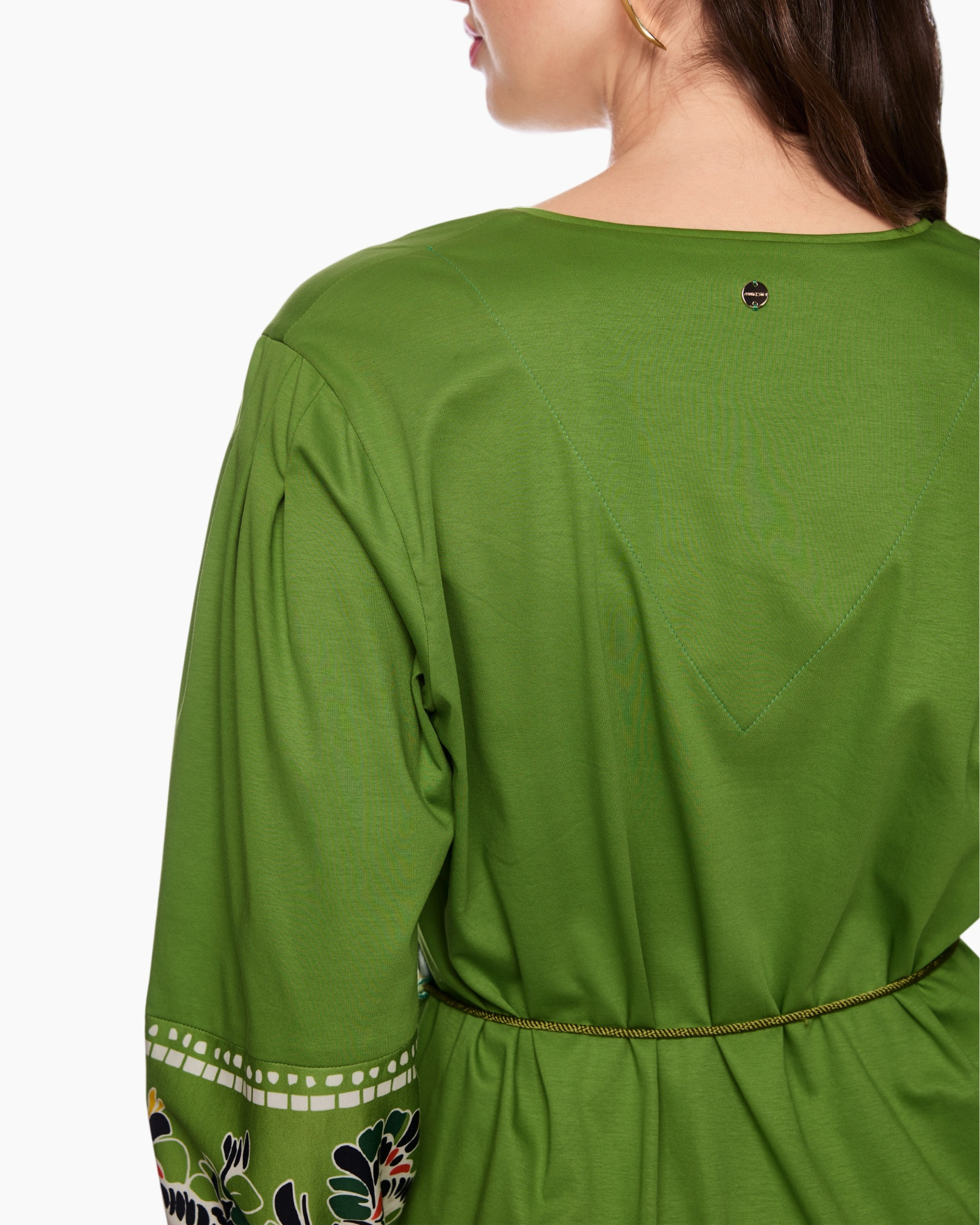 green tunic, long sleeve, embroidery trim, belted waist, back view