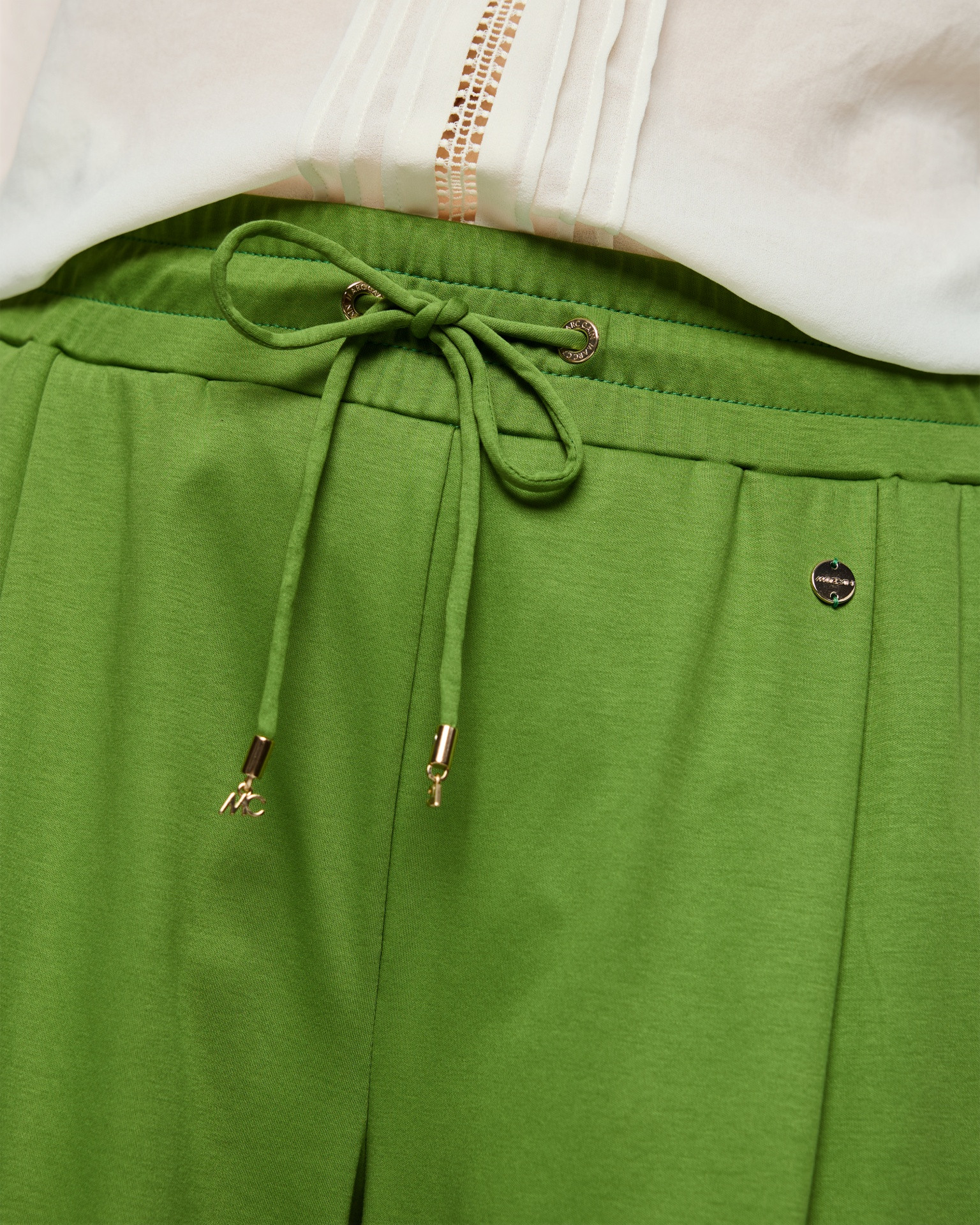 green pants, drawstring, waist tie, metallic hardware, elastic waistband