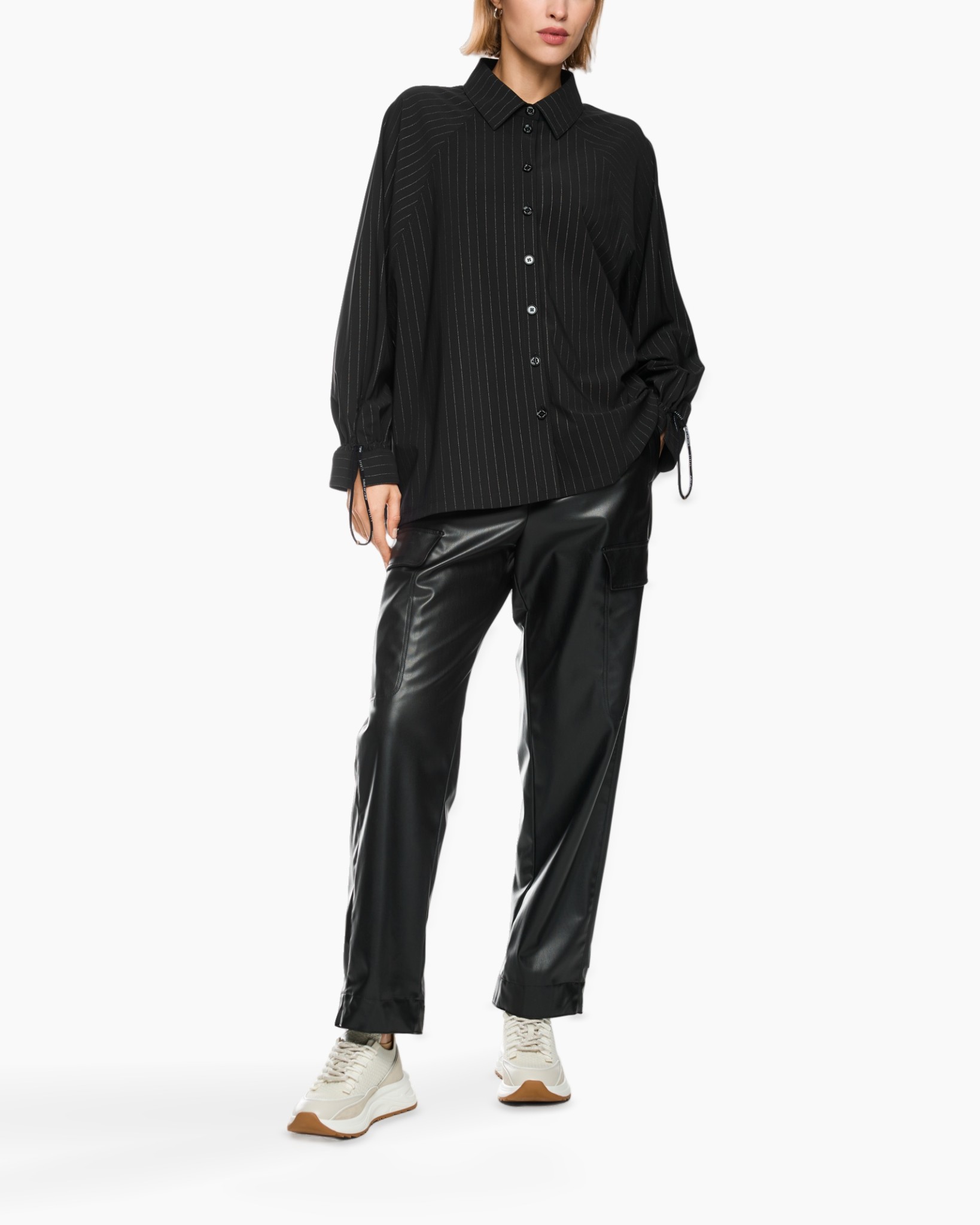 black striped shirt, button-down, collar shirt, loose fit, black pants, cargo pants, leather look, white sneakers