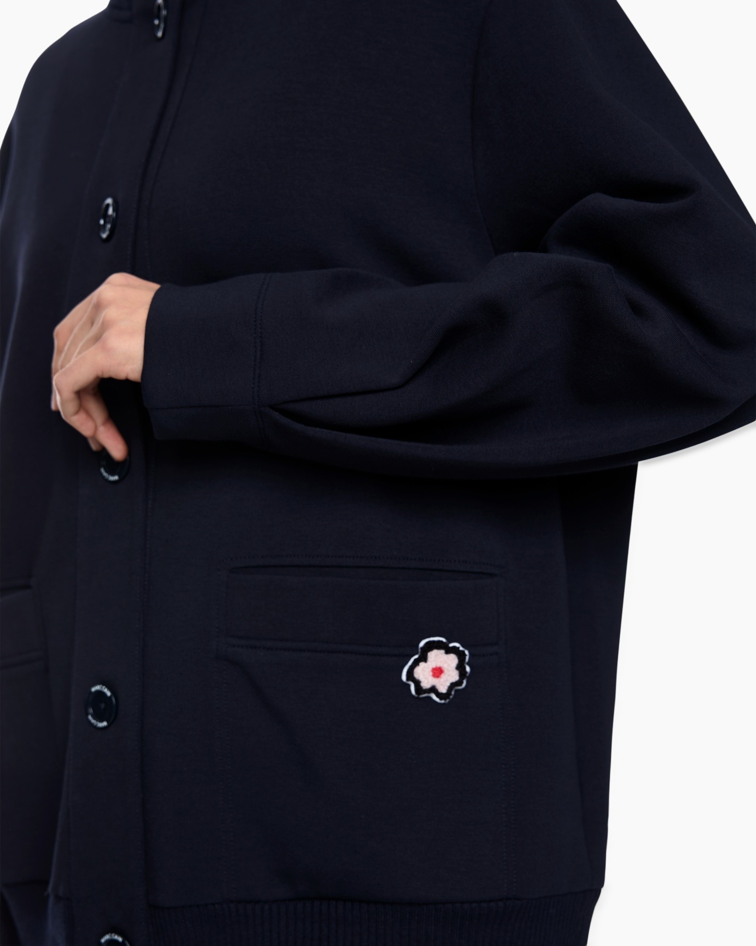 navy cardigan, button front, pocket detail, embroidered flower, knit fabric
